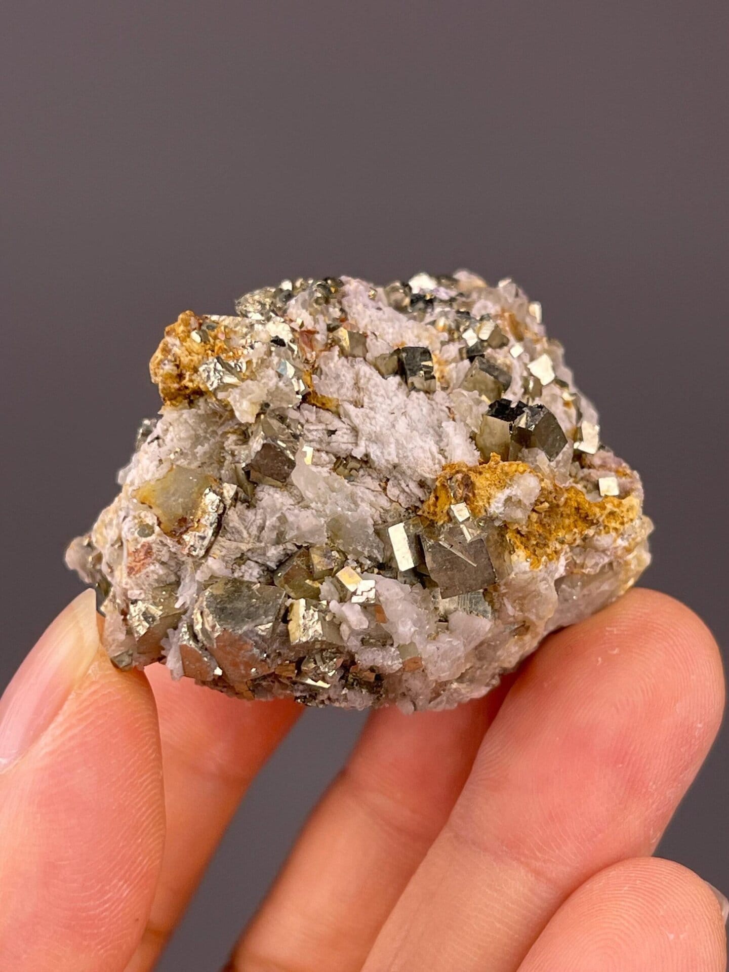 Back view of pyrite cluster on matrix