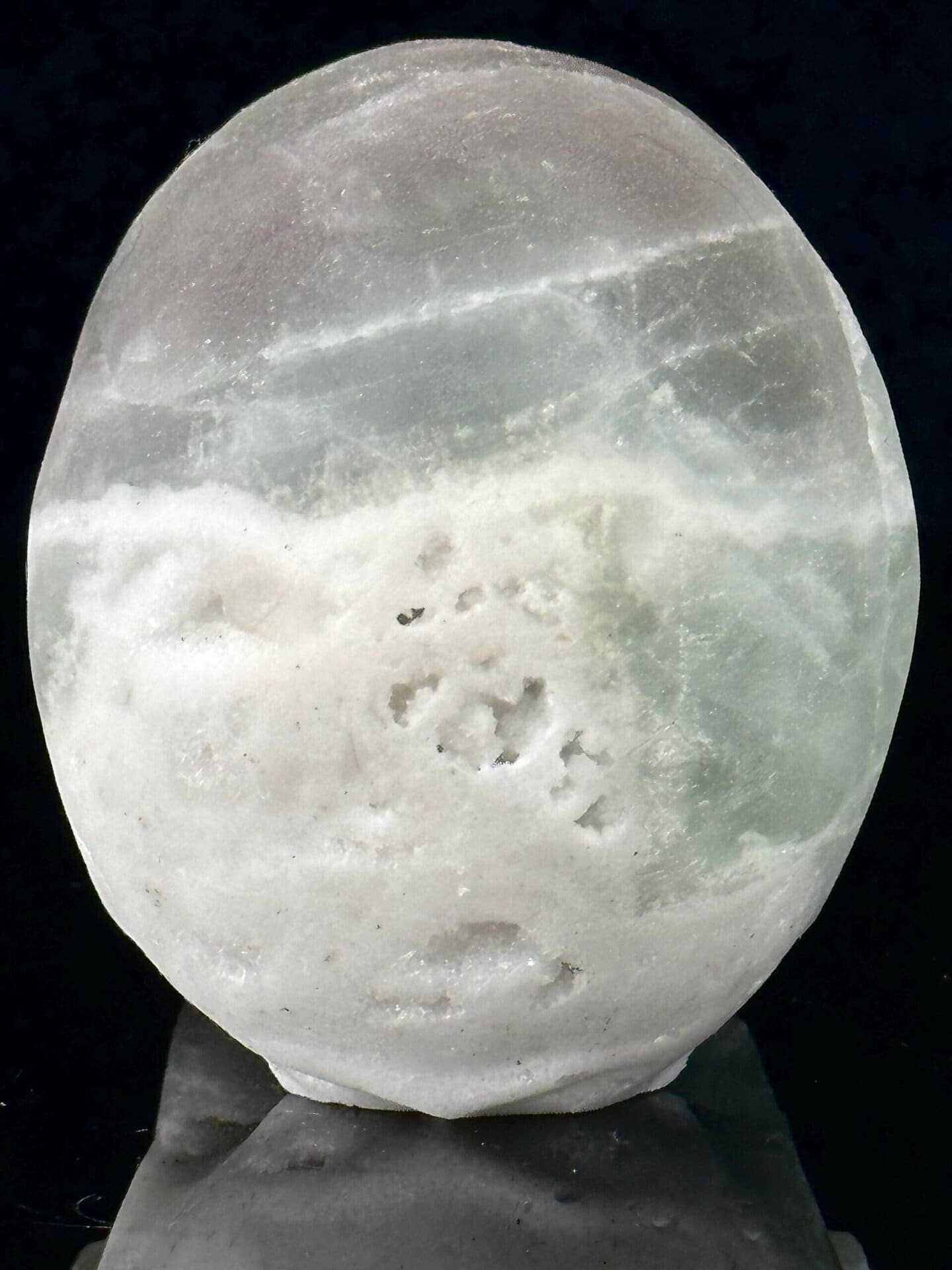 Brazilian green fluorite skull under studio lighting