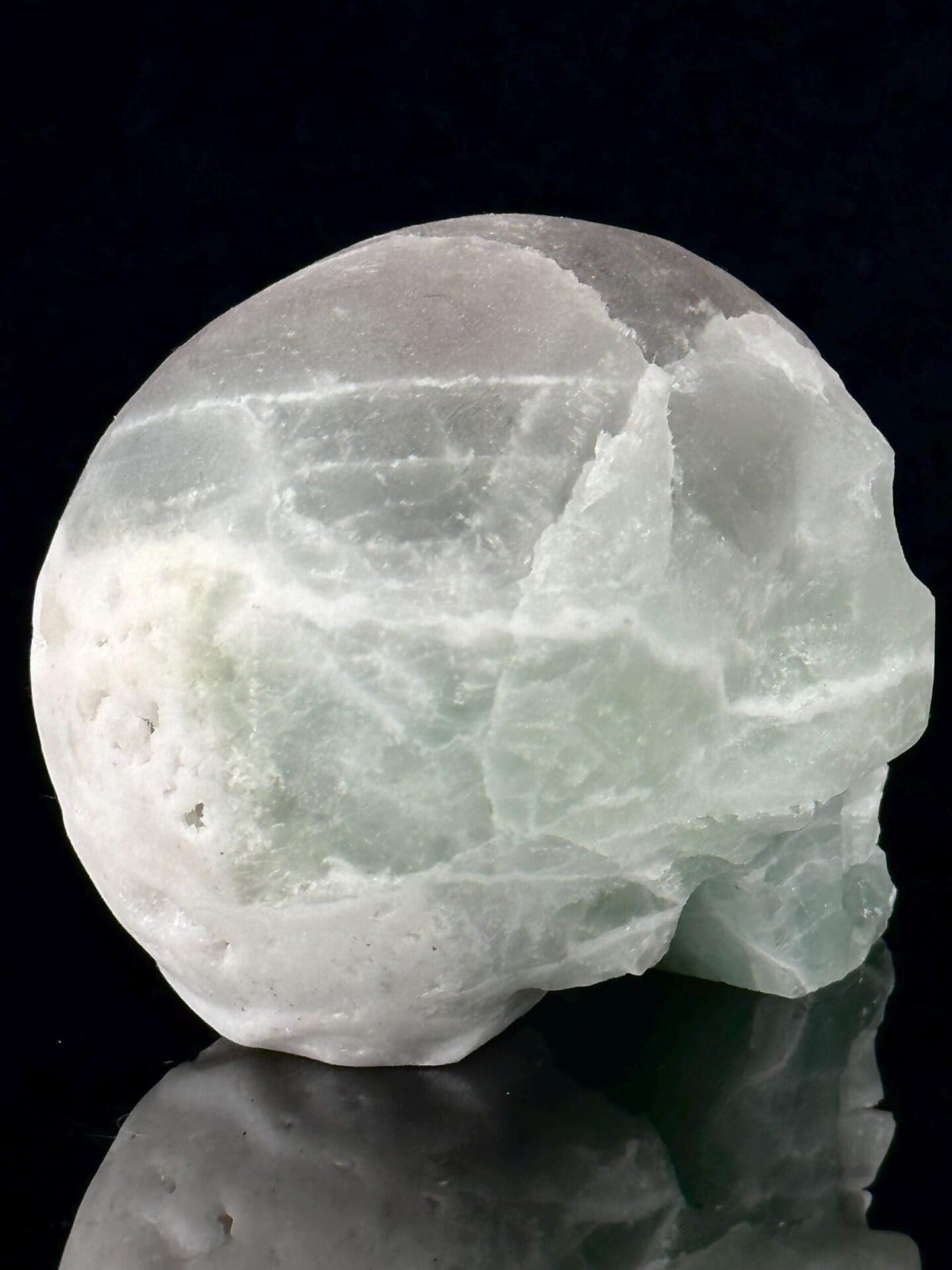 Carved fluorite texture contrasting with raw geode