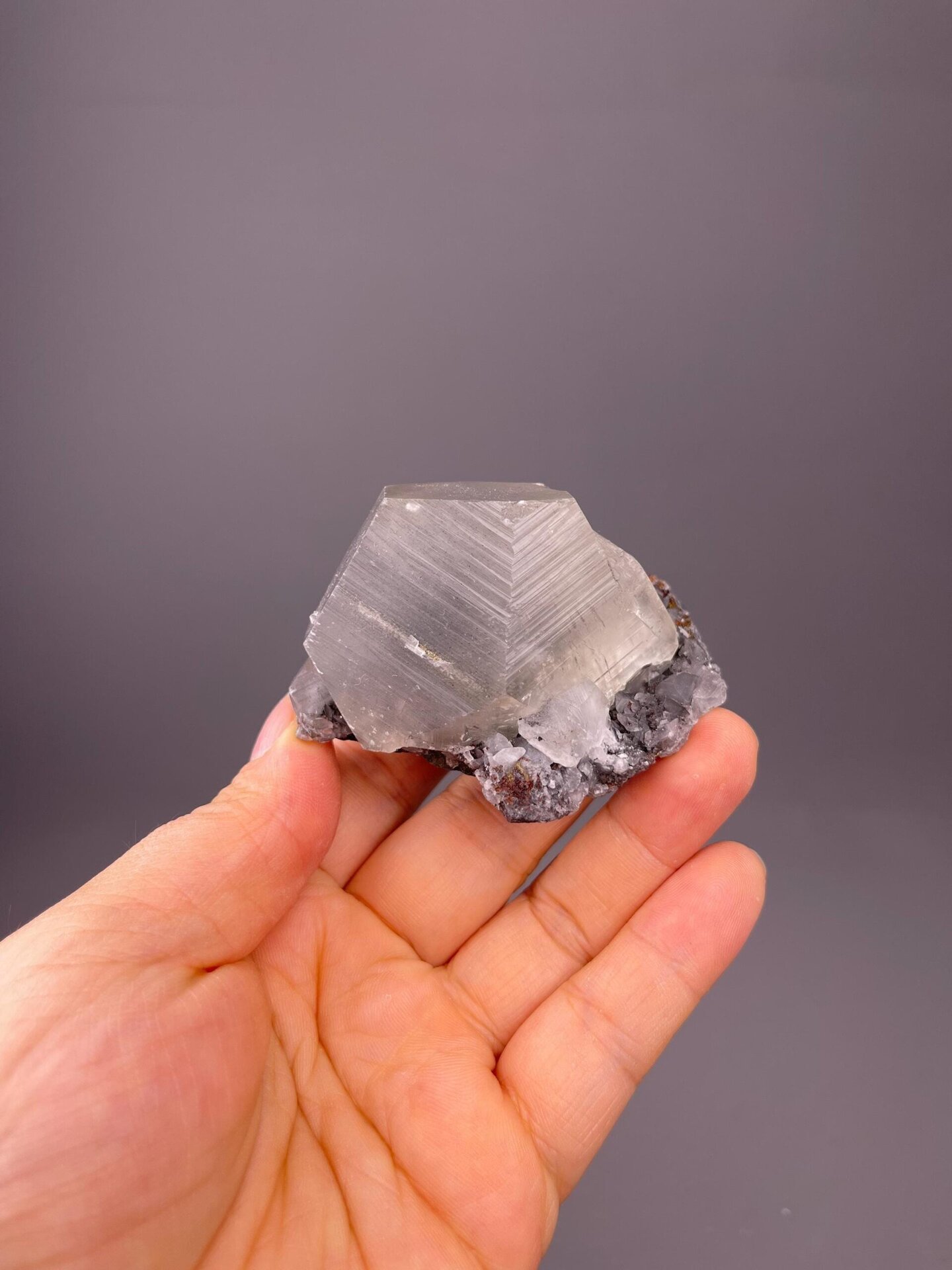 Vitreous luster on etched calcite crystal face