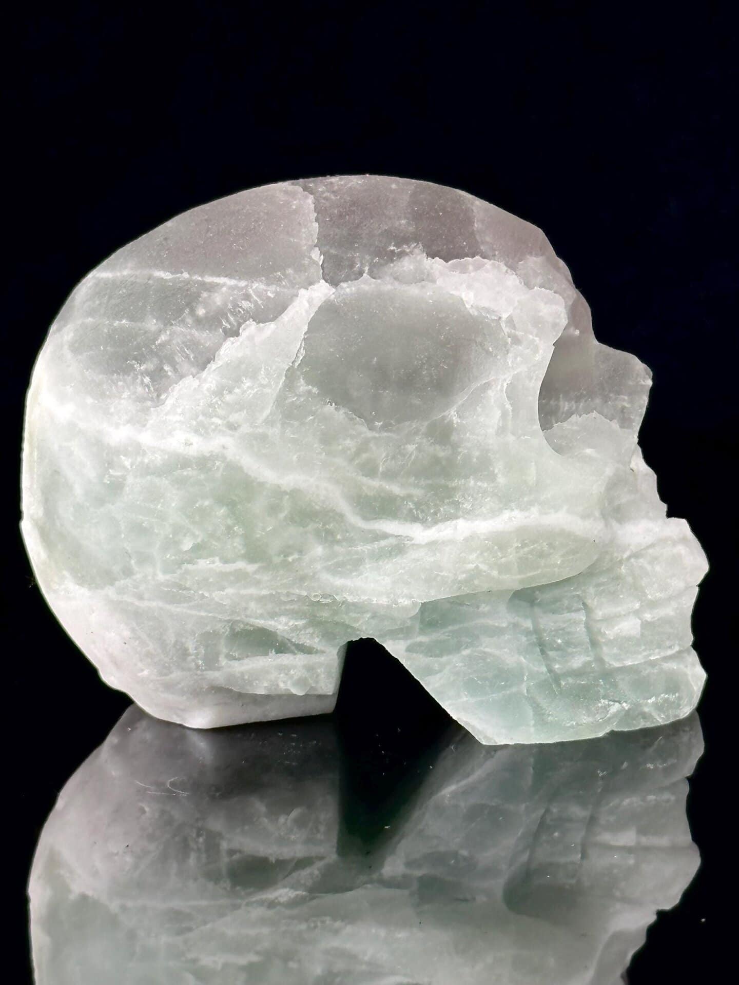 Scale reference of green fluorite skull 3.2 inches tall