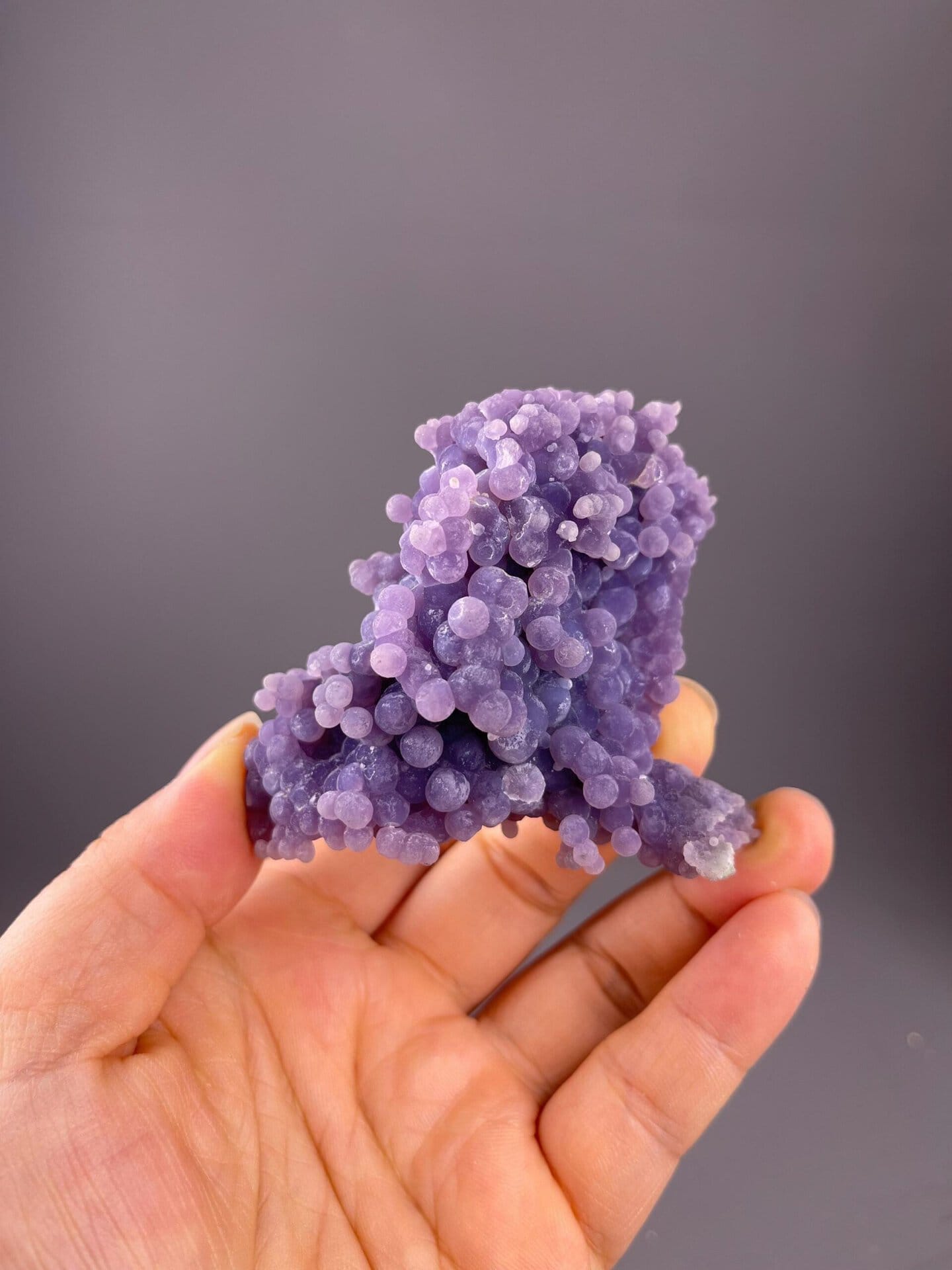 Scale reference of purple grape agate cluster from Indonesia