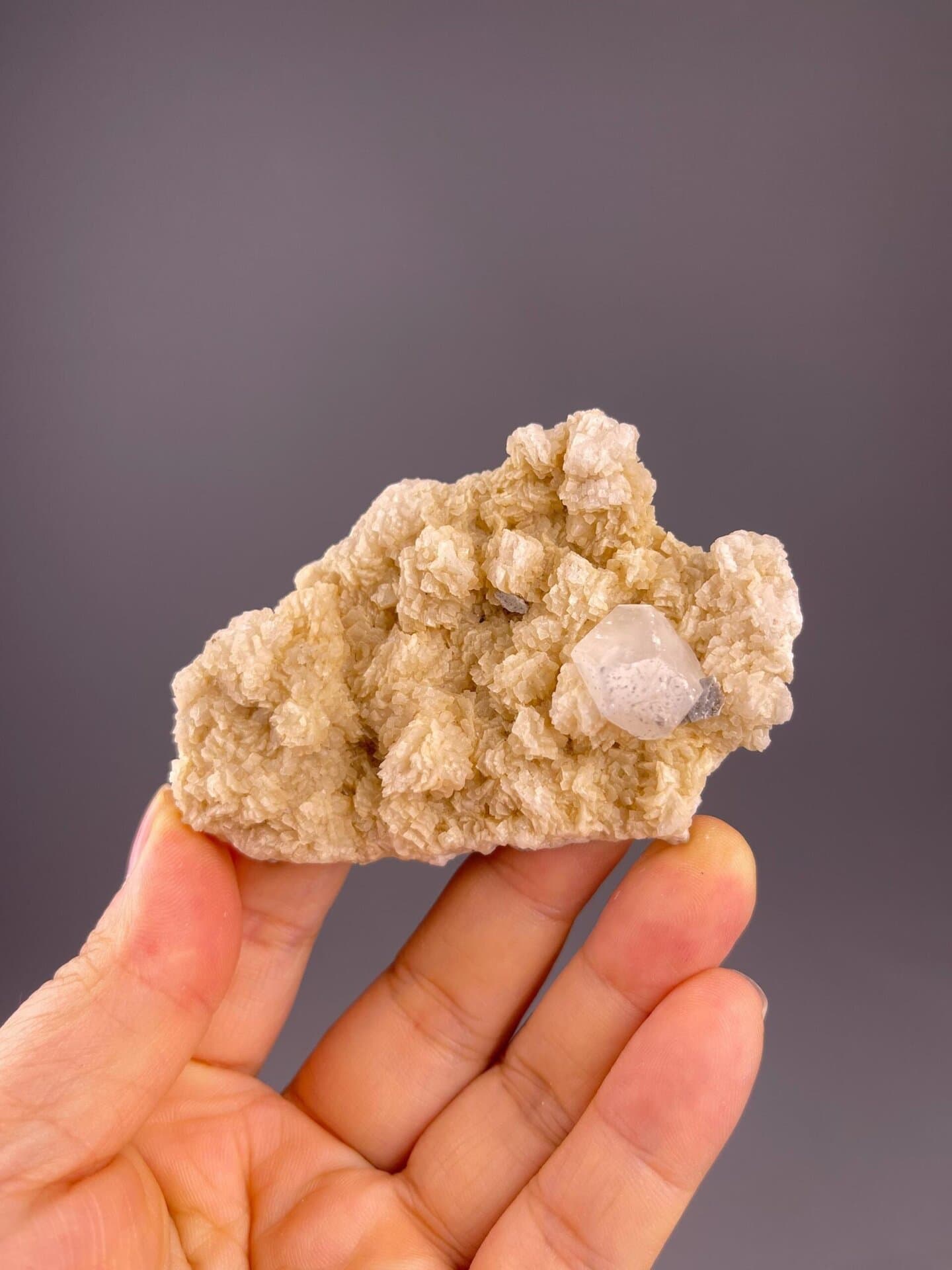 Front view of clear fluorite on dolomite matrix, 3.1×0.7×2 in