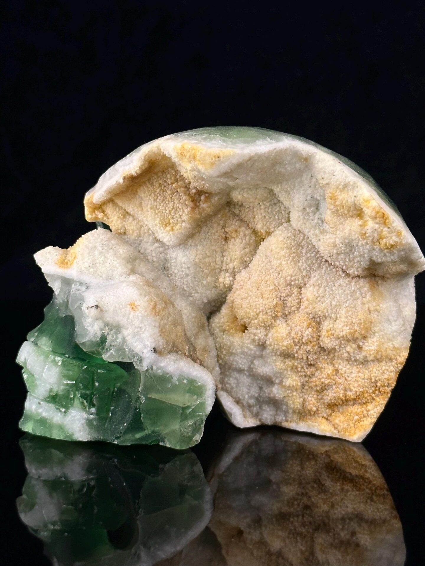 Close-up of green fluorite skull with crystal interior