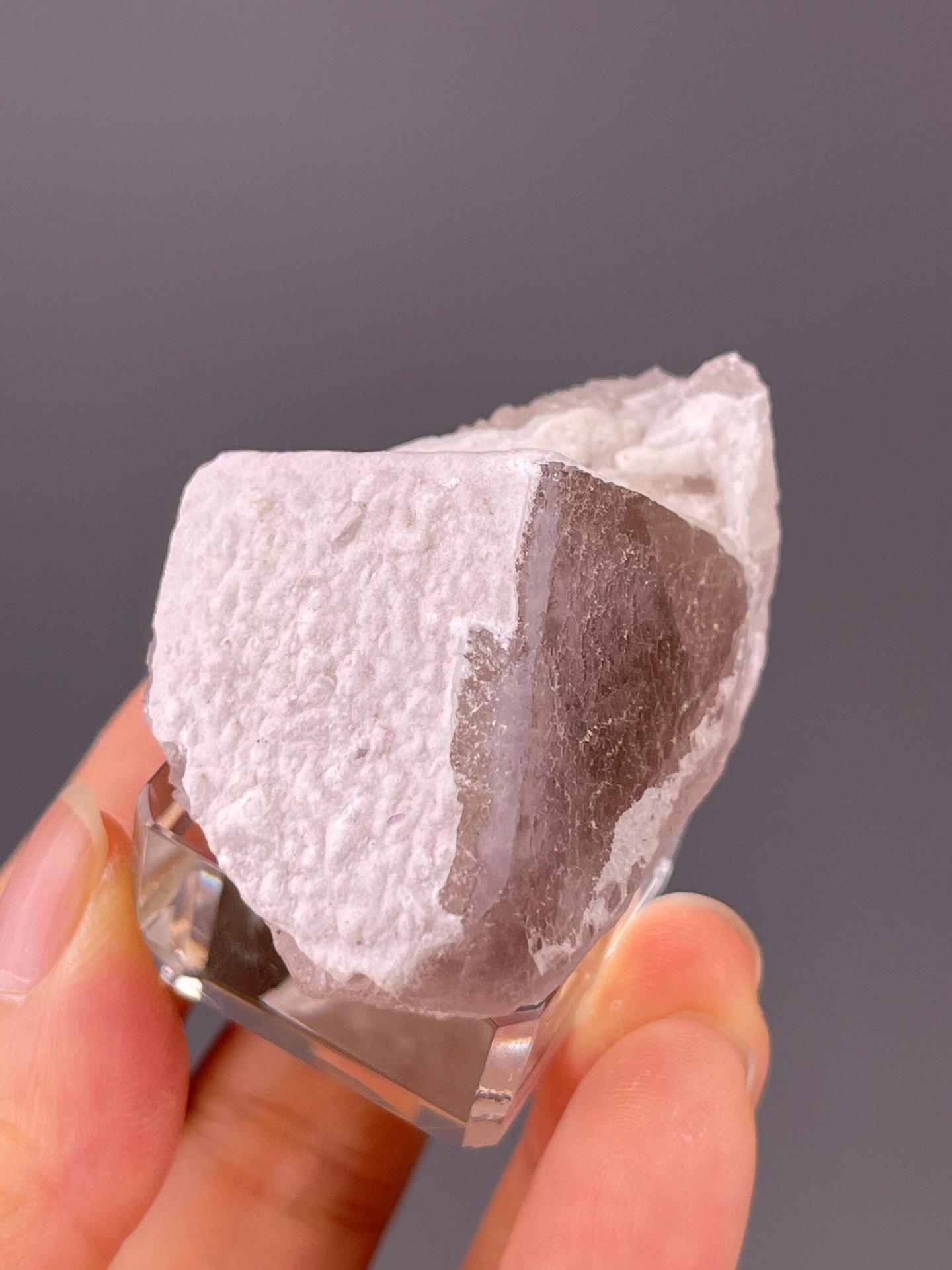 Angled view of purple fluorite QR-code formation on quartz