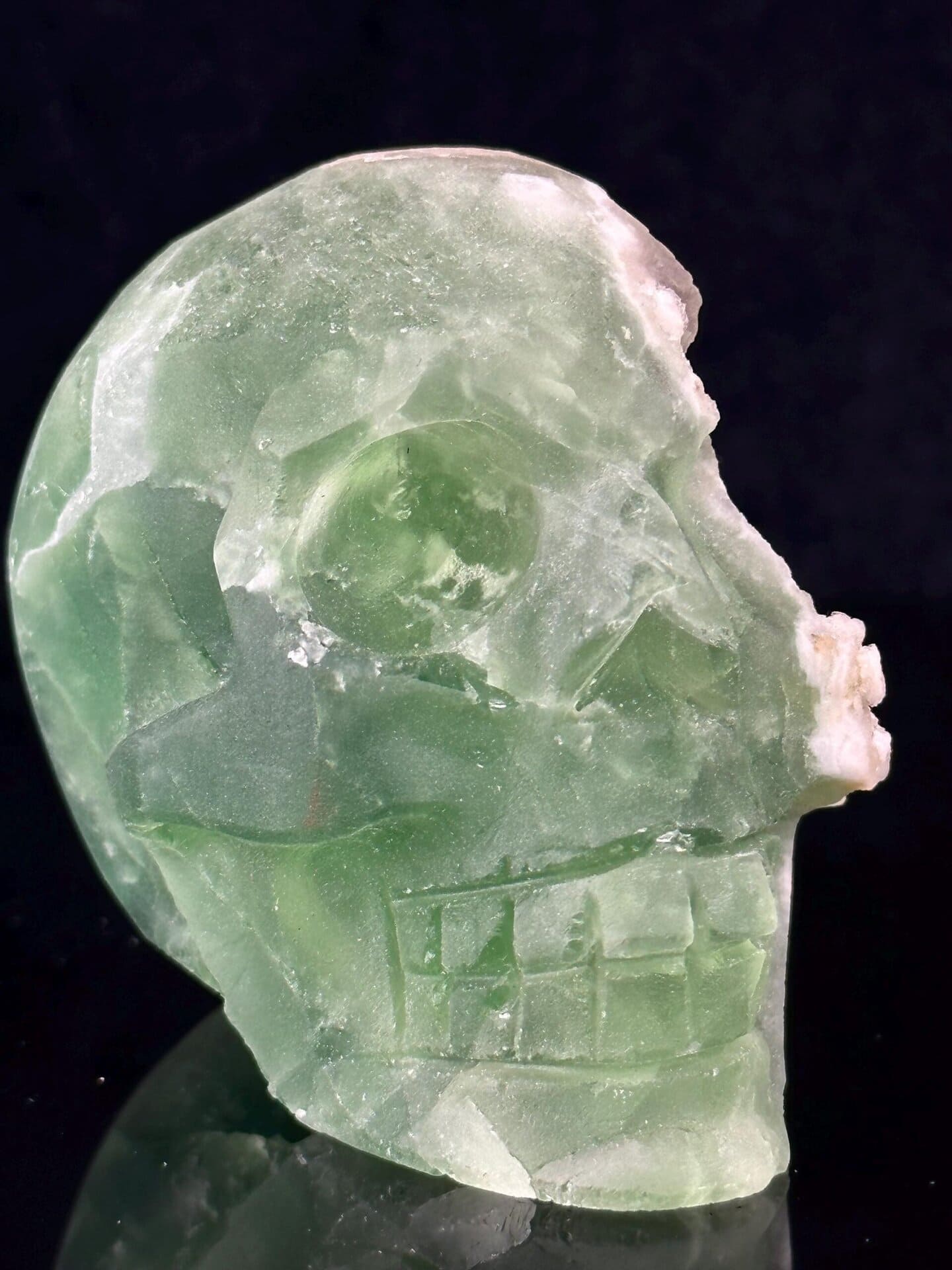 Base of hand-carved green fluorite skull specimen