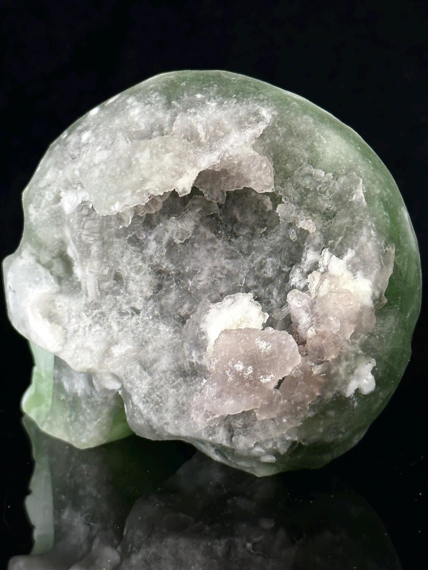 Back view of hand-carved green fluorite skull, China