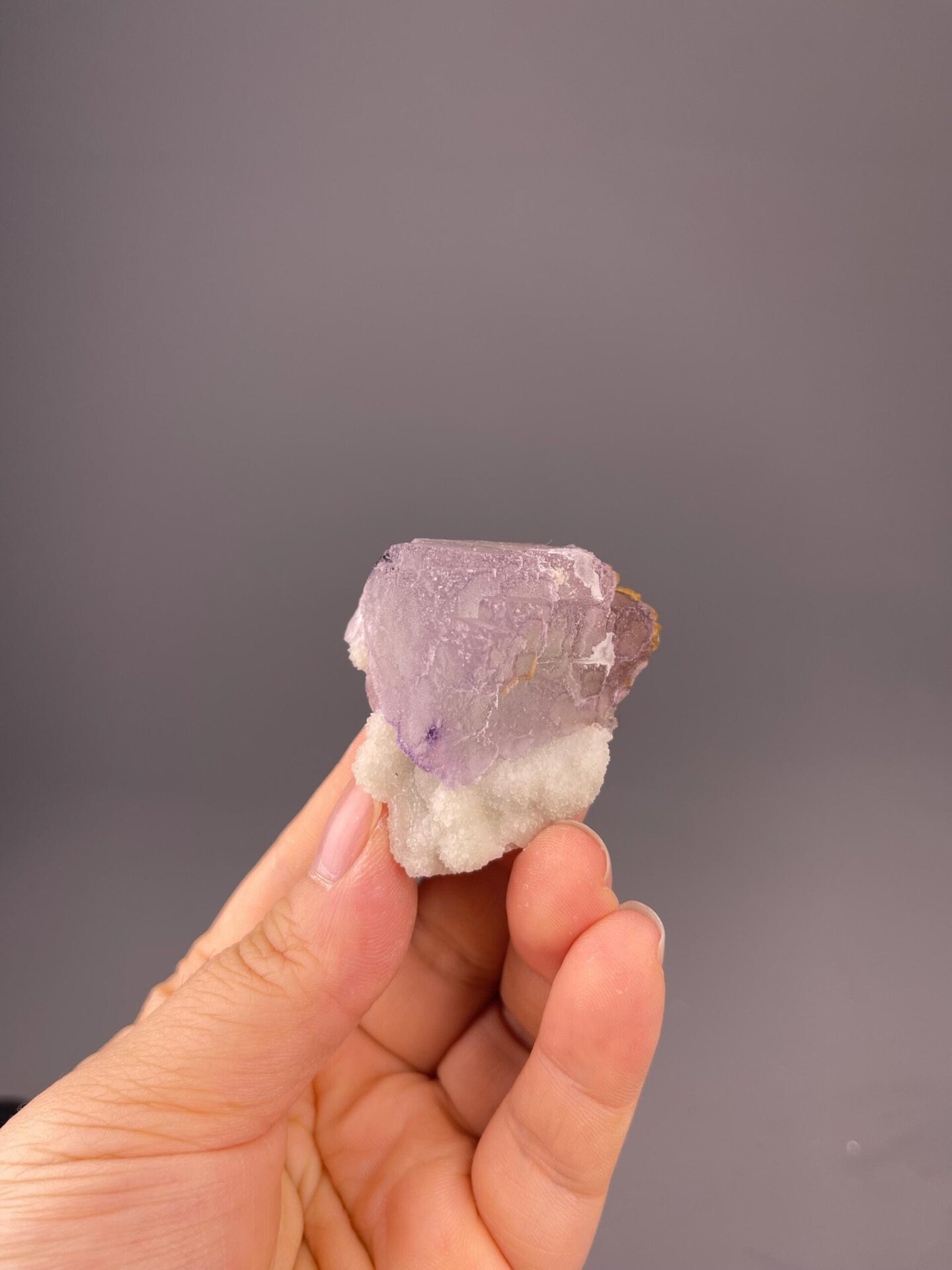 Front view of purple fluorite cube showing QR-code pattern