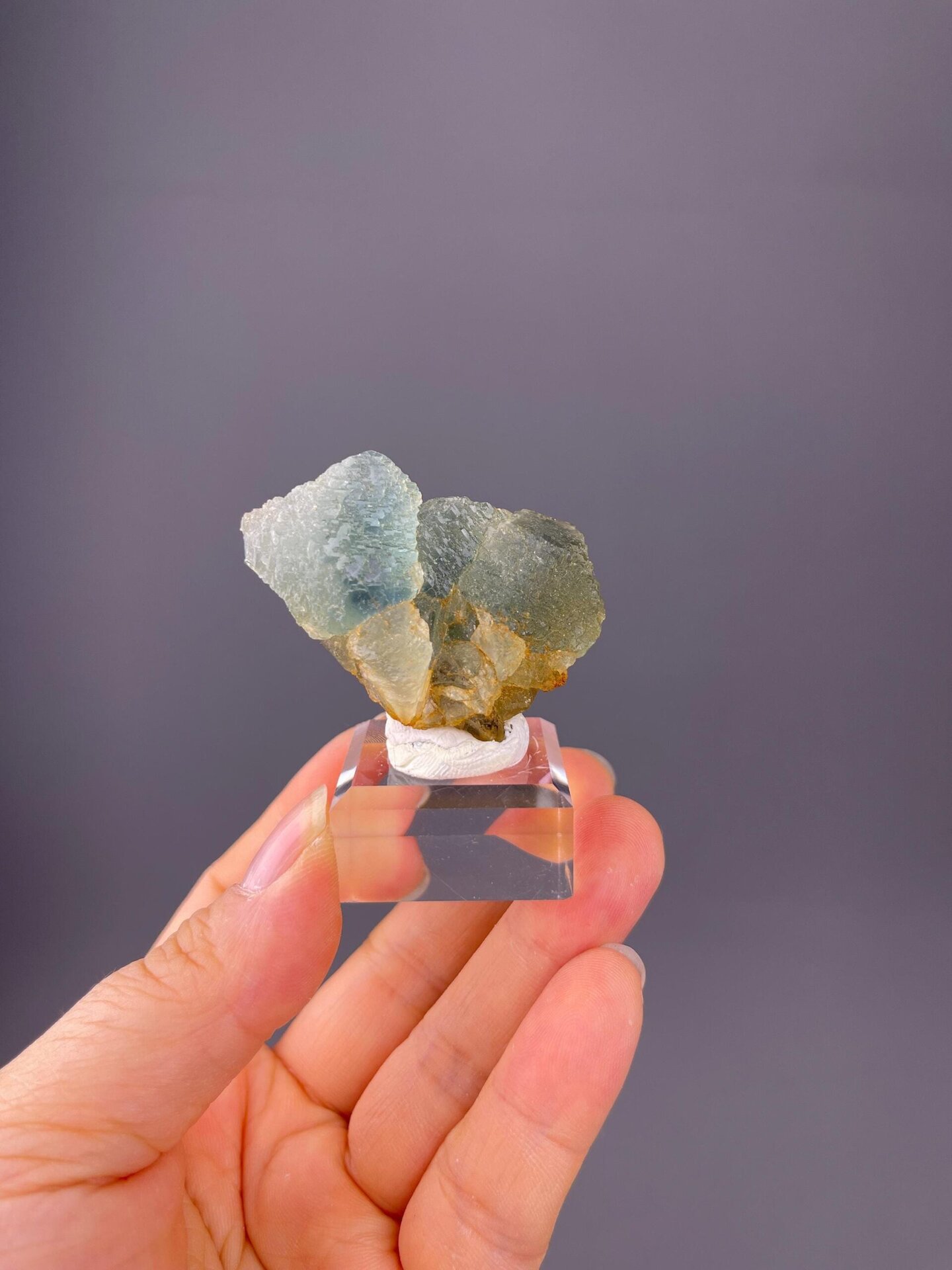 Front view of twinned blue-green fluorite showing etching