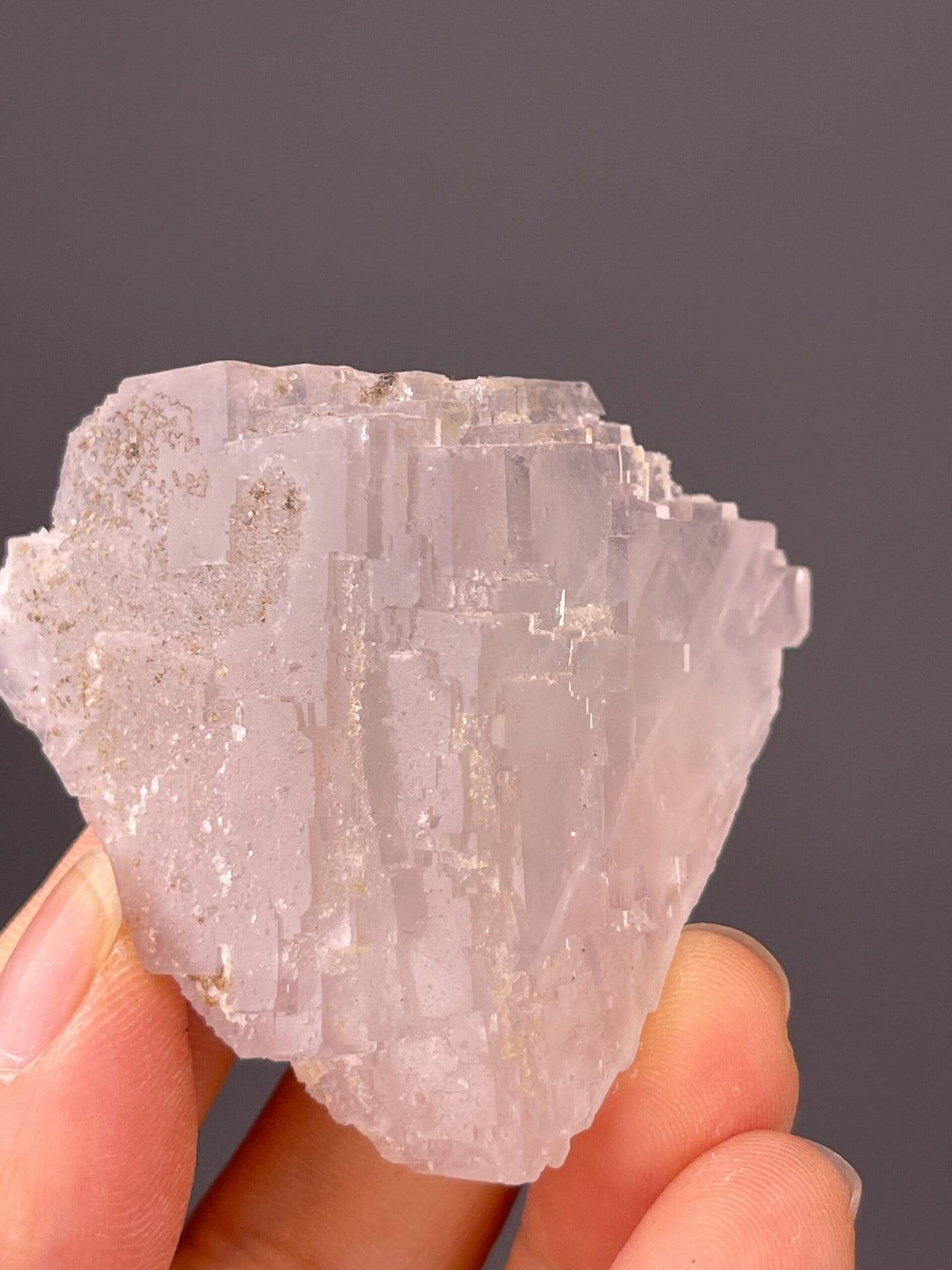 Front view of pale blue fluorite with sugar coating, 2×2×1.1 in