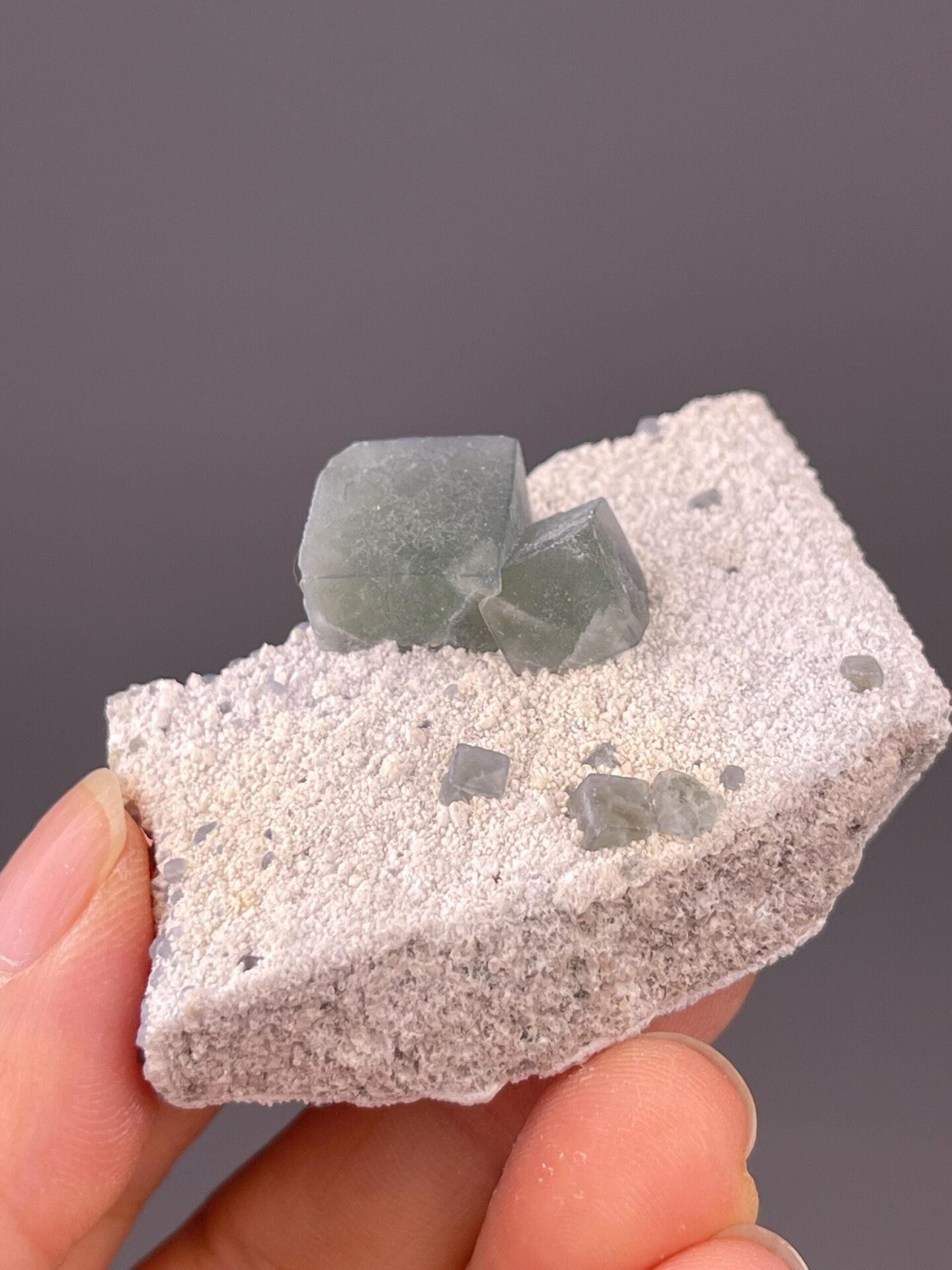 Side view of green fluorite on sandy matrix, Inner Mongolia