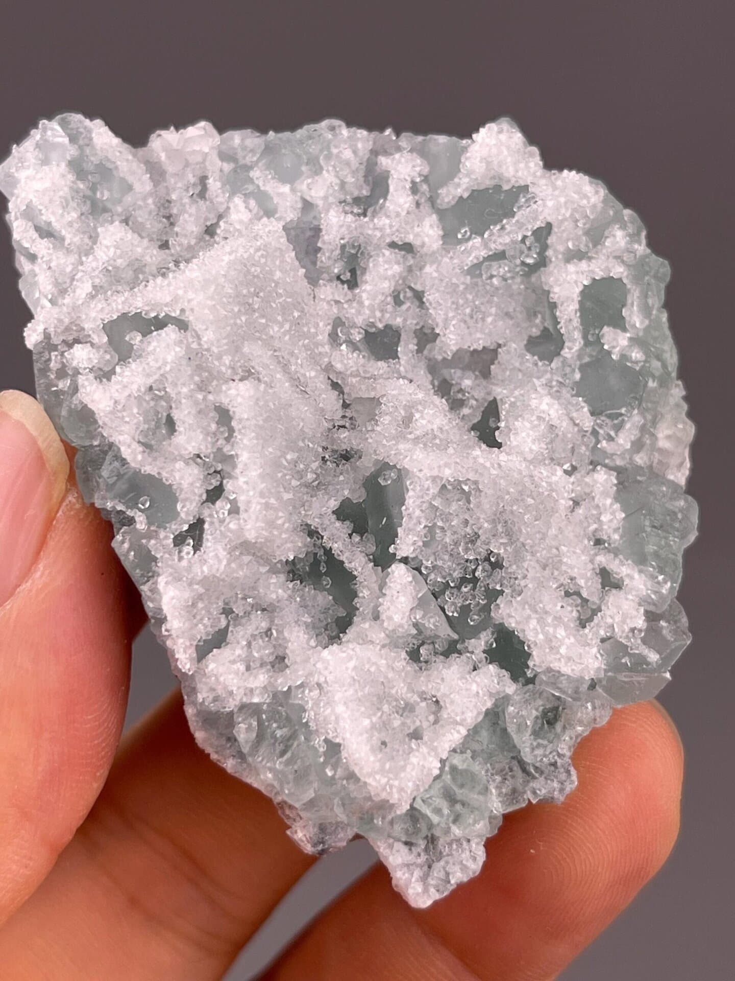 Translucent green fluorite with druzy quartz, China