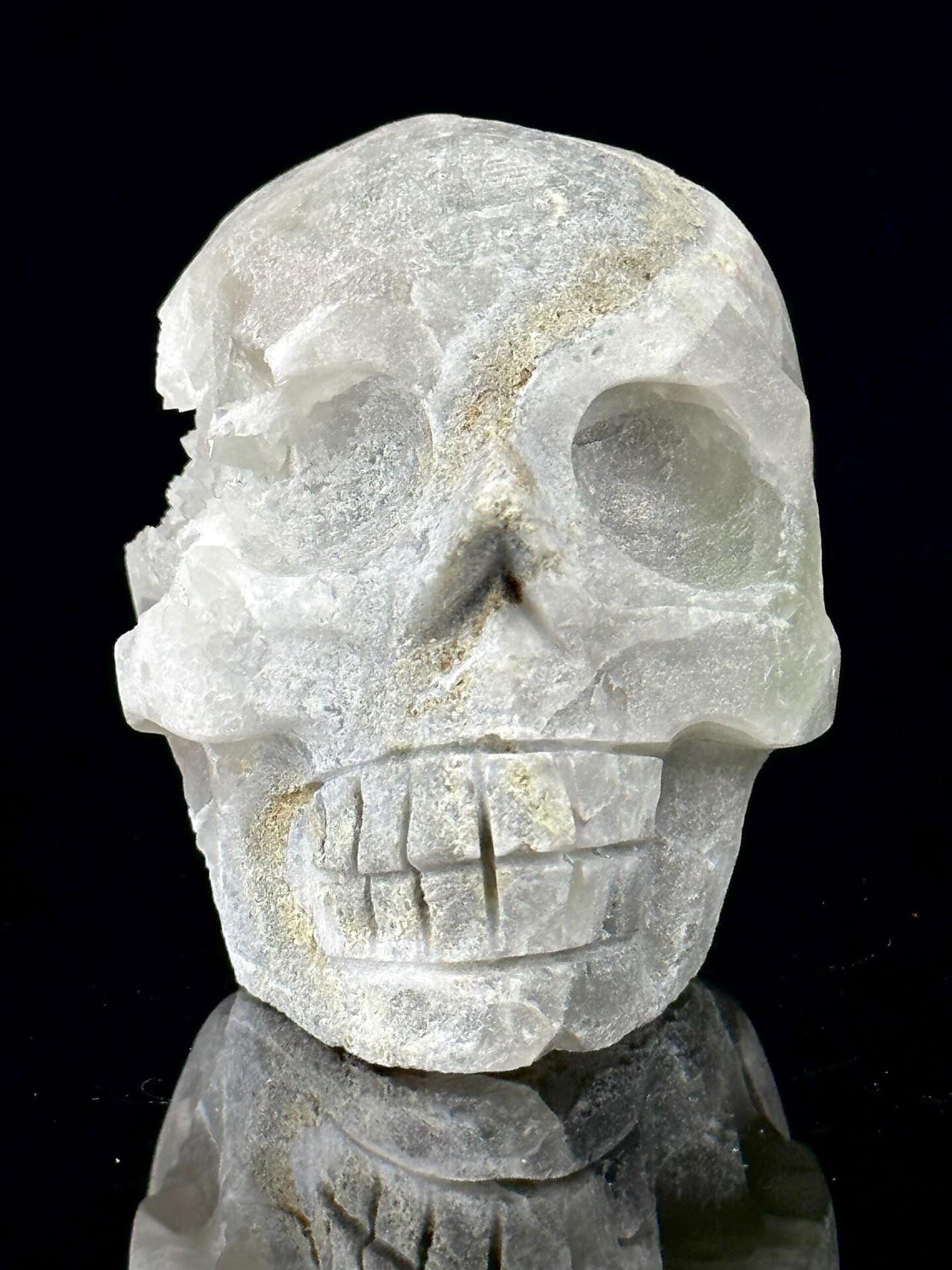 Fluorite skull with quartz geode interior, display mineral sculpture