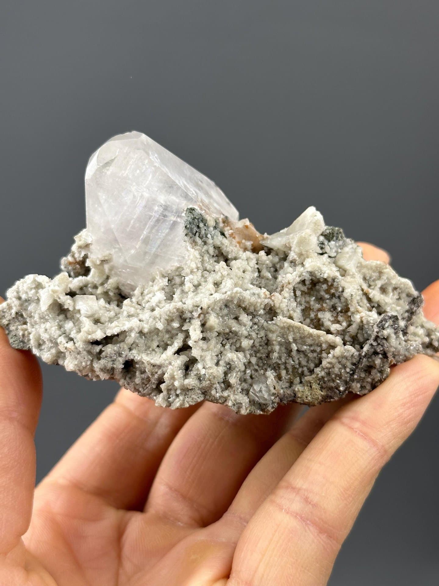 Side view of calcite specimen showing transparent crystals