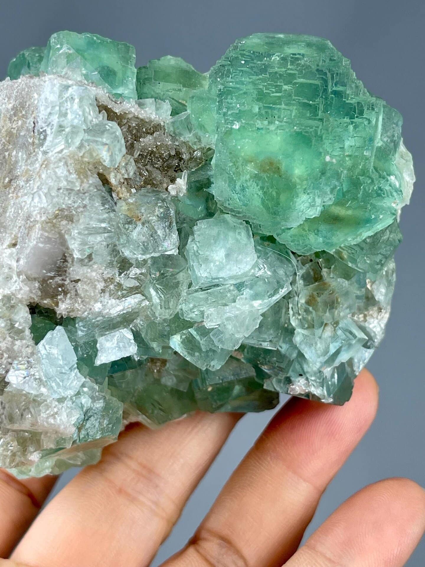 Apple-green fluorite cluster displaying vitreous luster