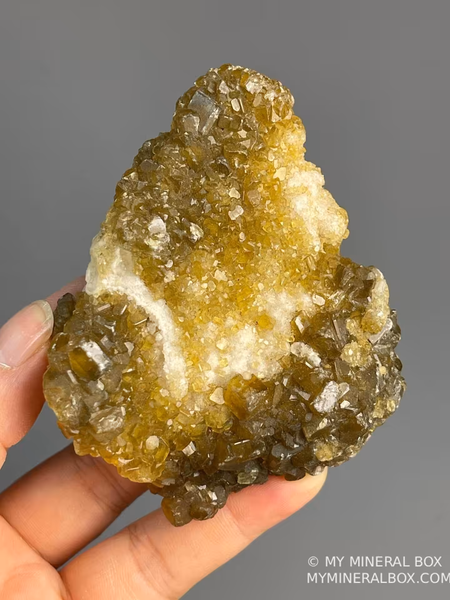 Golden barite calcite cluster displaying vitreous luster