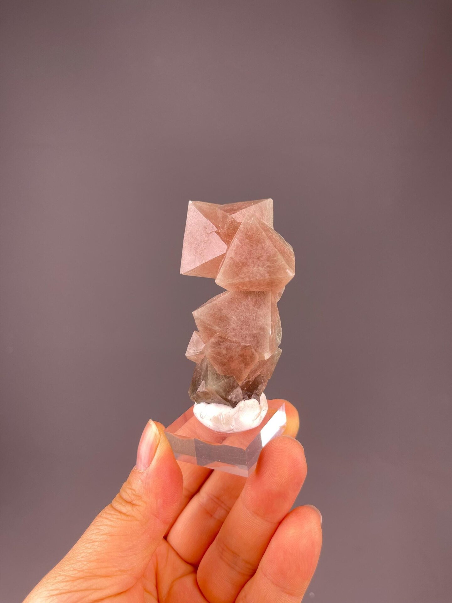 Side view of red fluorite octahedral cluster, China