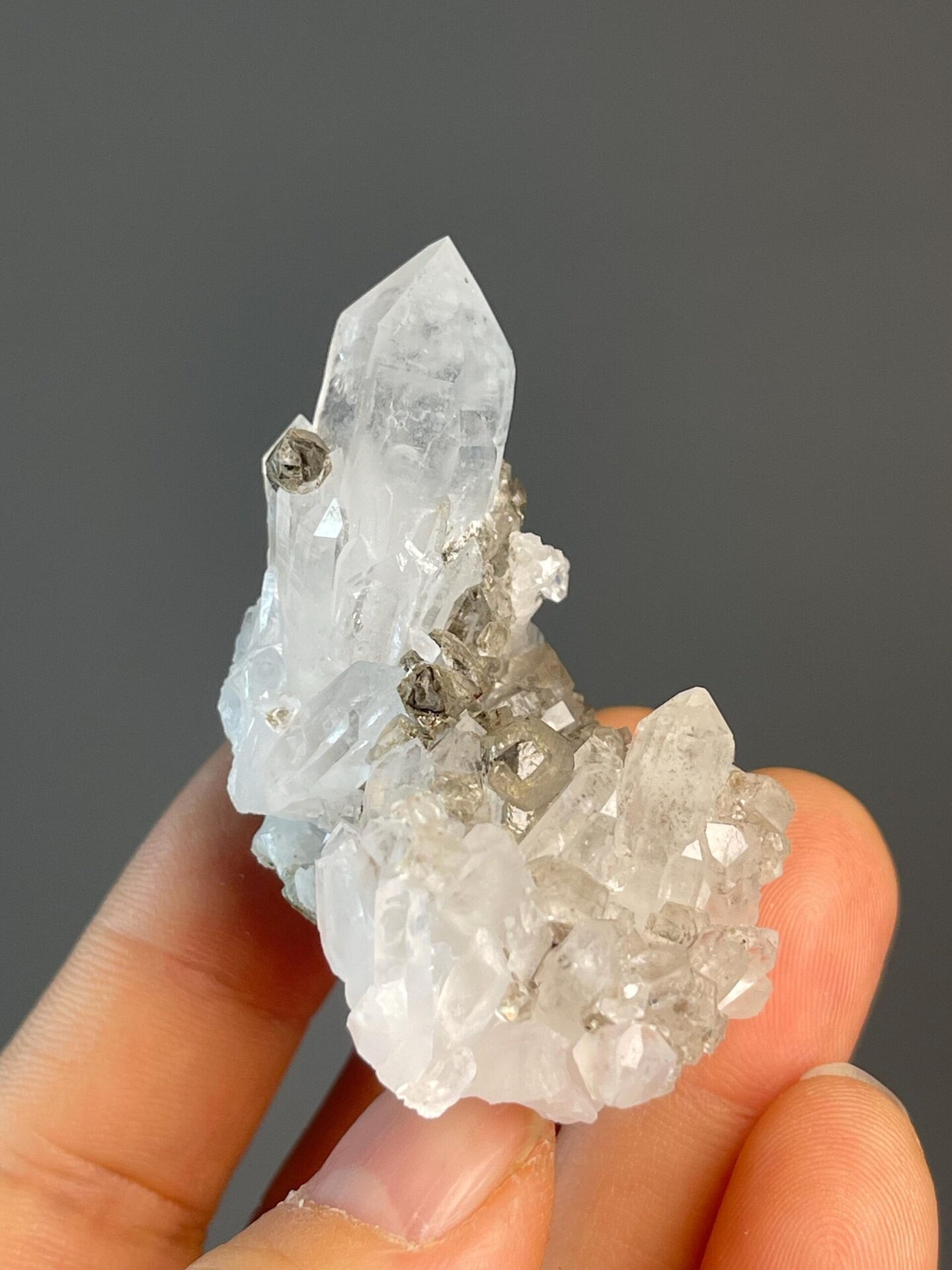 Multiple smoky quartz points forming tower cluster
