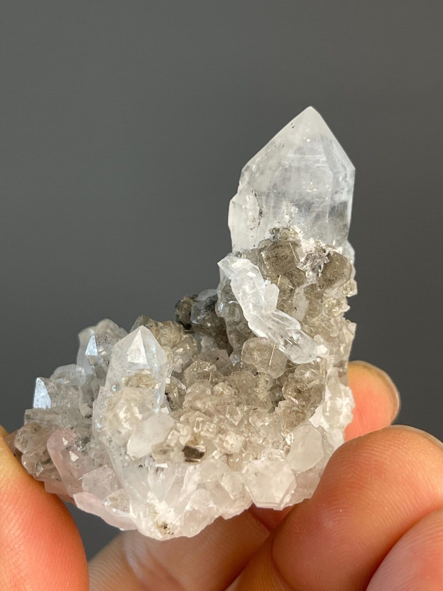 Smoky quartz tower cluster displaying vitreous luster