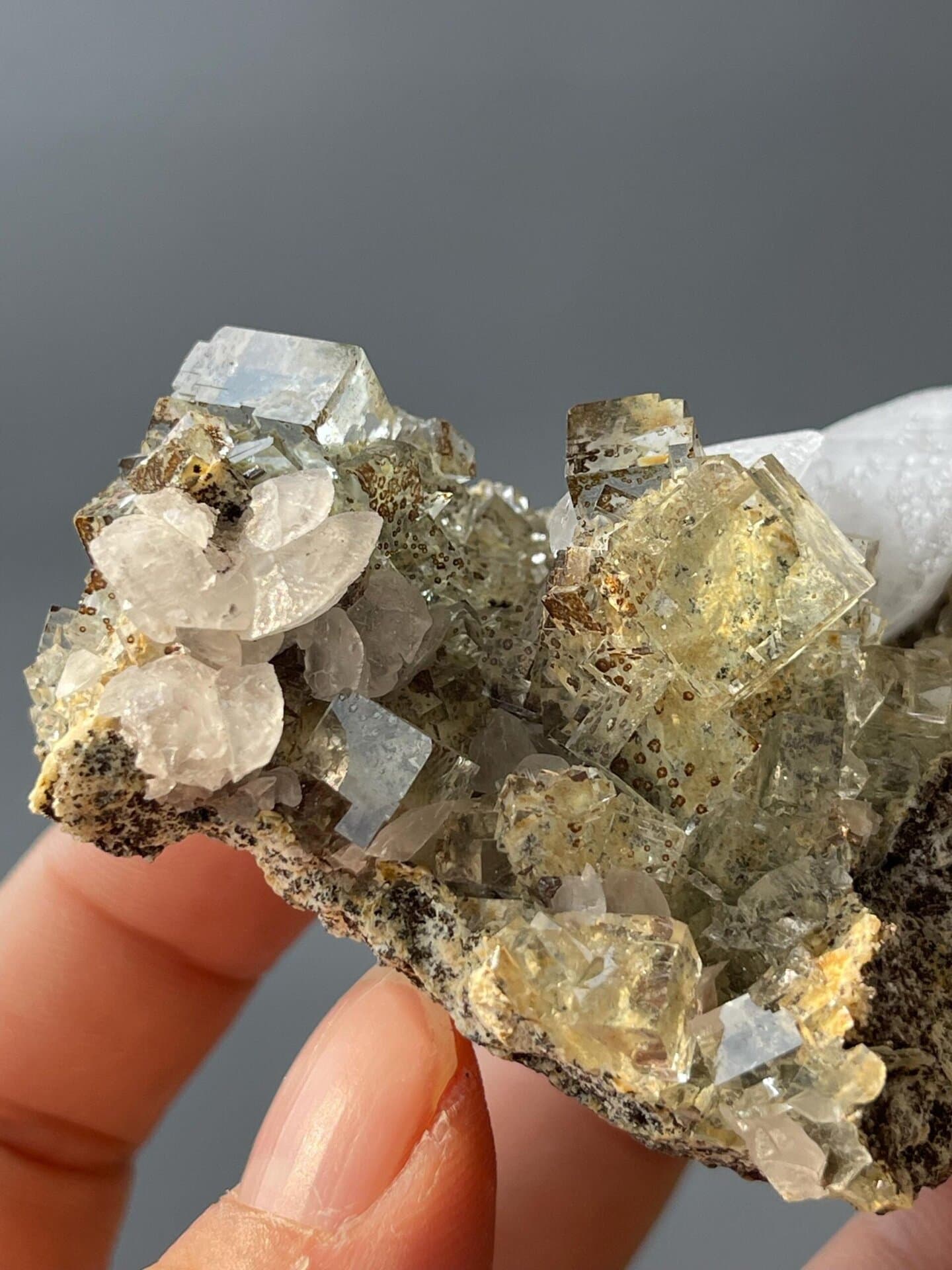 Transparent fluorite cubes with distinctive leopard growth pattern