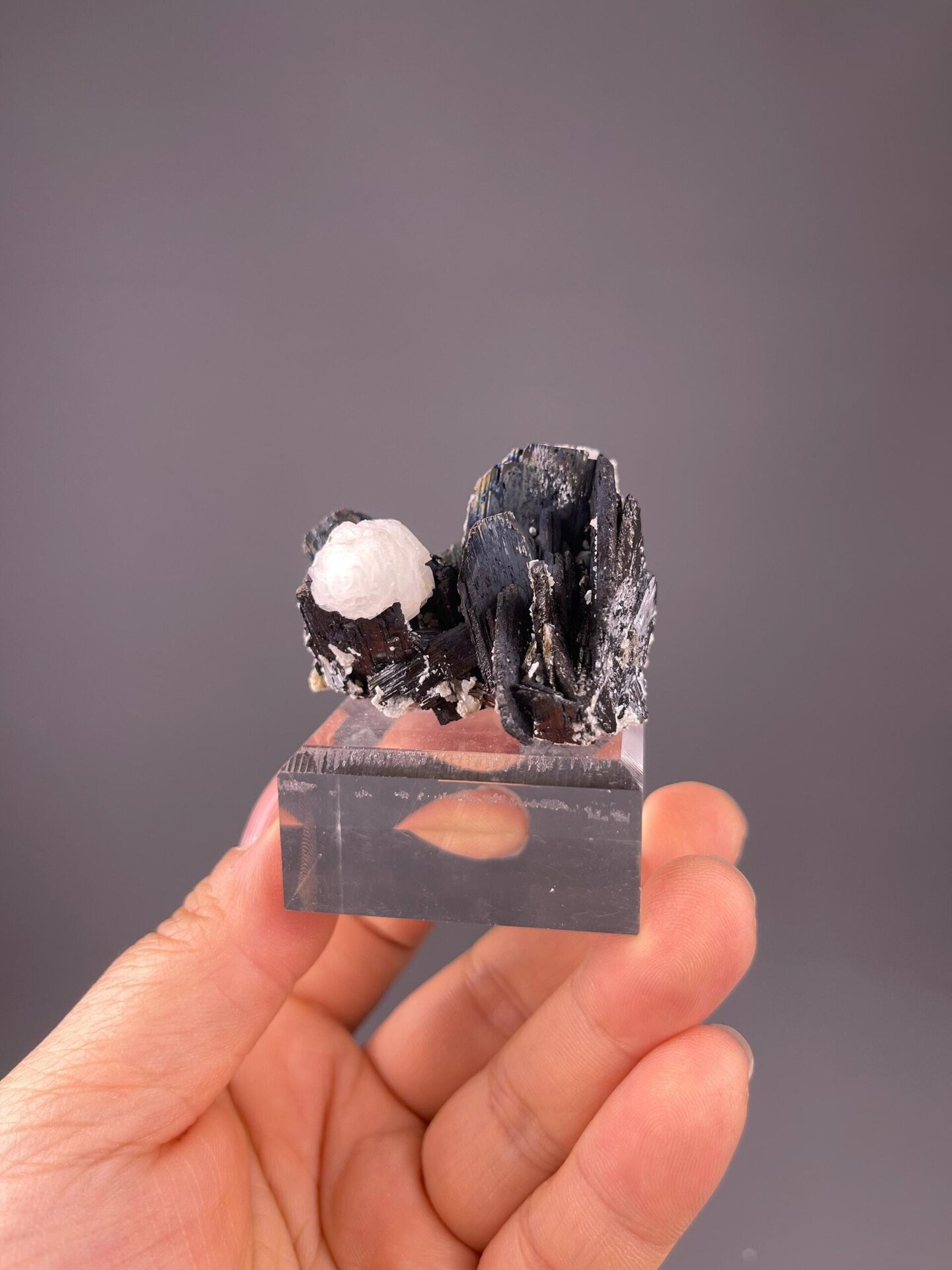 Dark cassiterite crystals with white calcite, YGX China