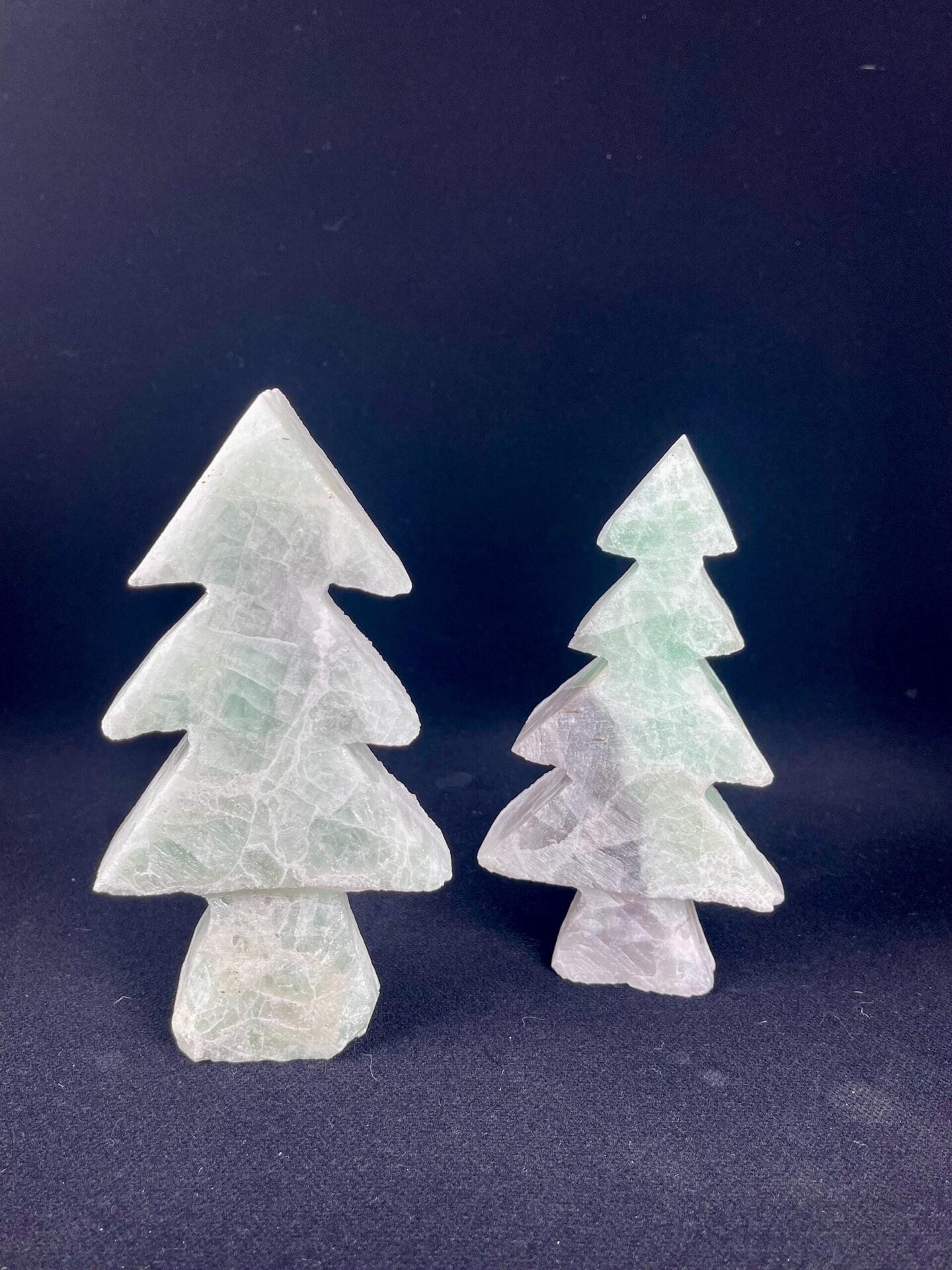 Side view of dual-color fluorite tree sculpture carving