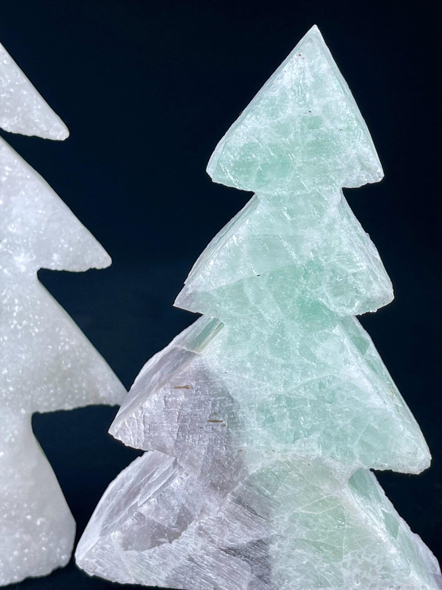 Carved fluorite tree showing dual-color mineral variation
