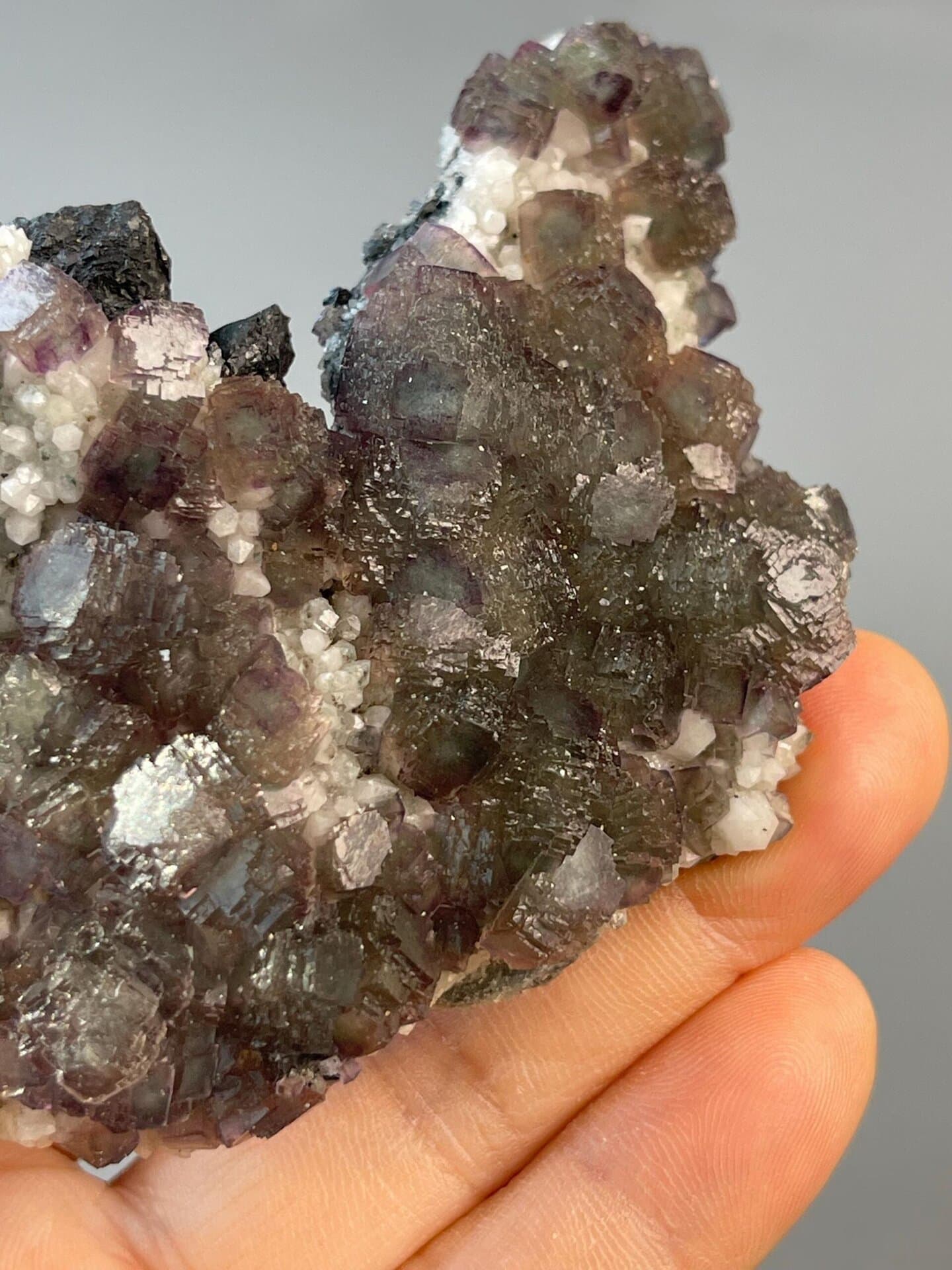 Stepped matrix fluorite showing purple and green growth zones