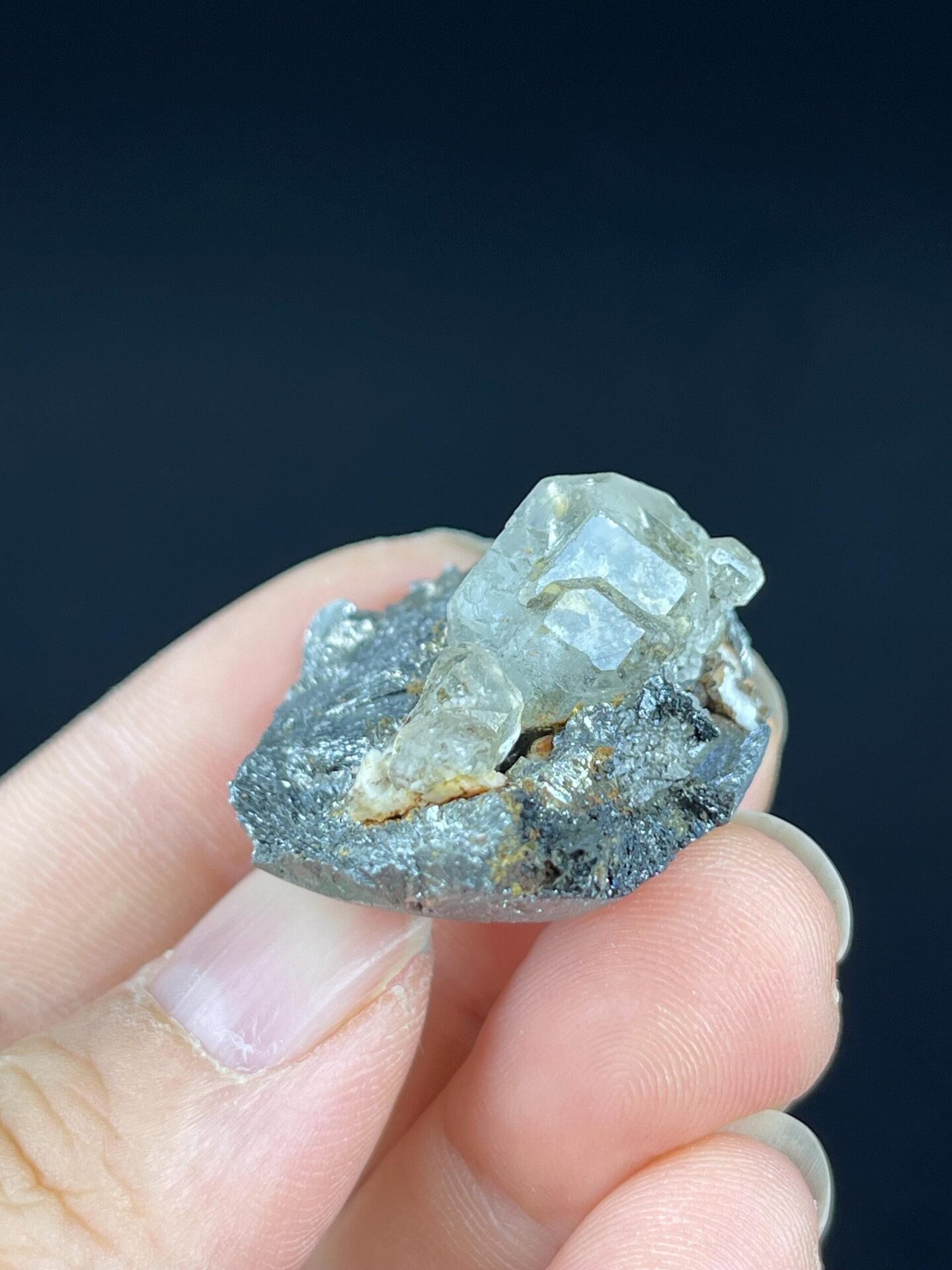 Fluorite sphere contrasting with textured iron rock matrix