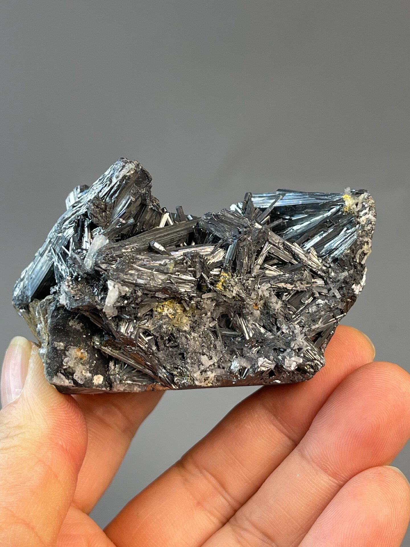 Brilliant metallic luster of stibnite cluster, China