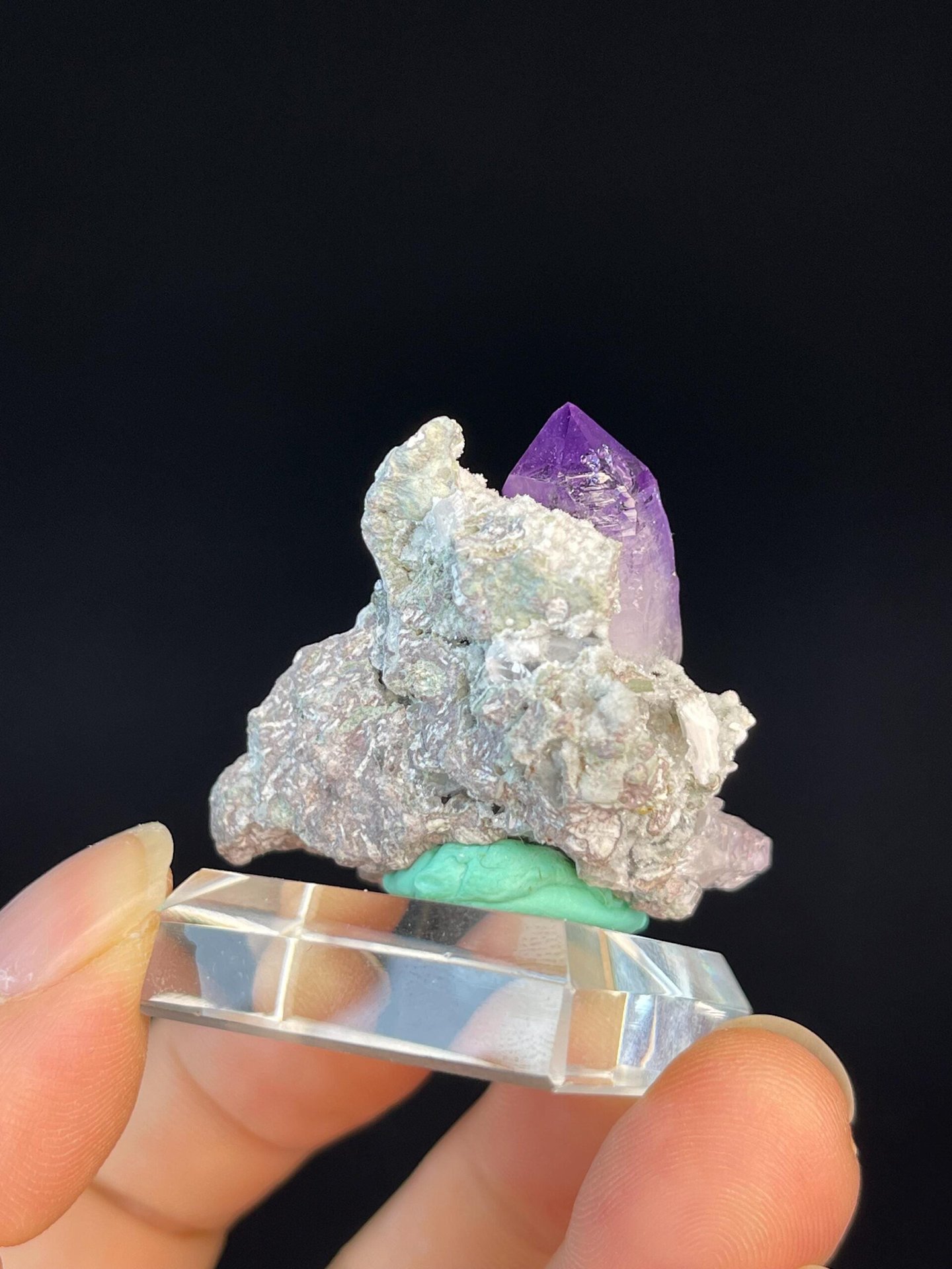 Amethyst crystal cluster displaying vitreous luster