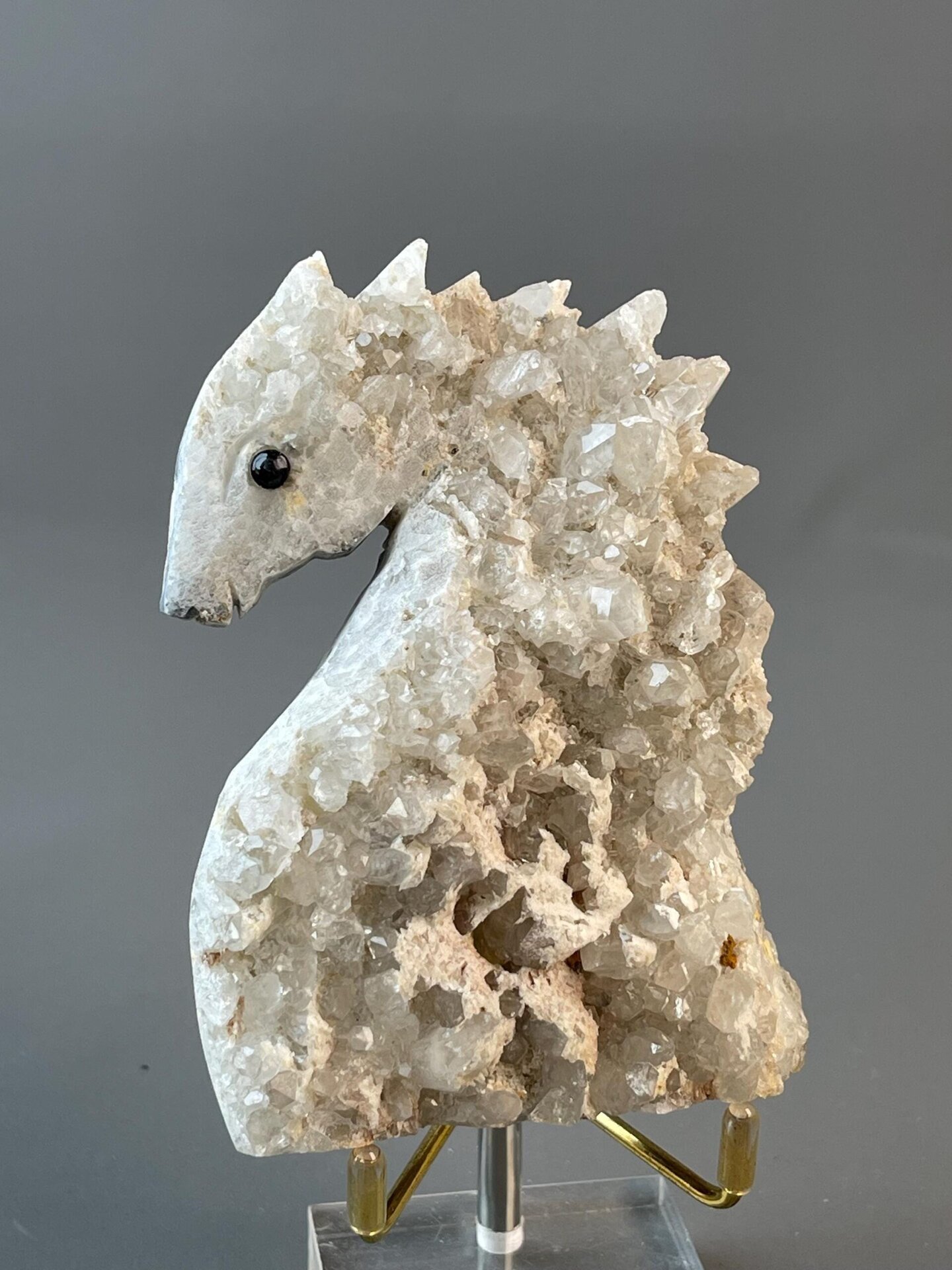 Hand-carved quartz seahorse sculpture with onyx eyes