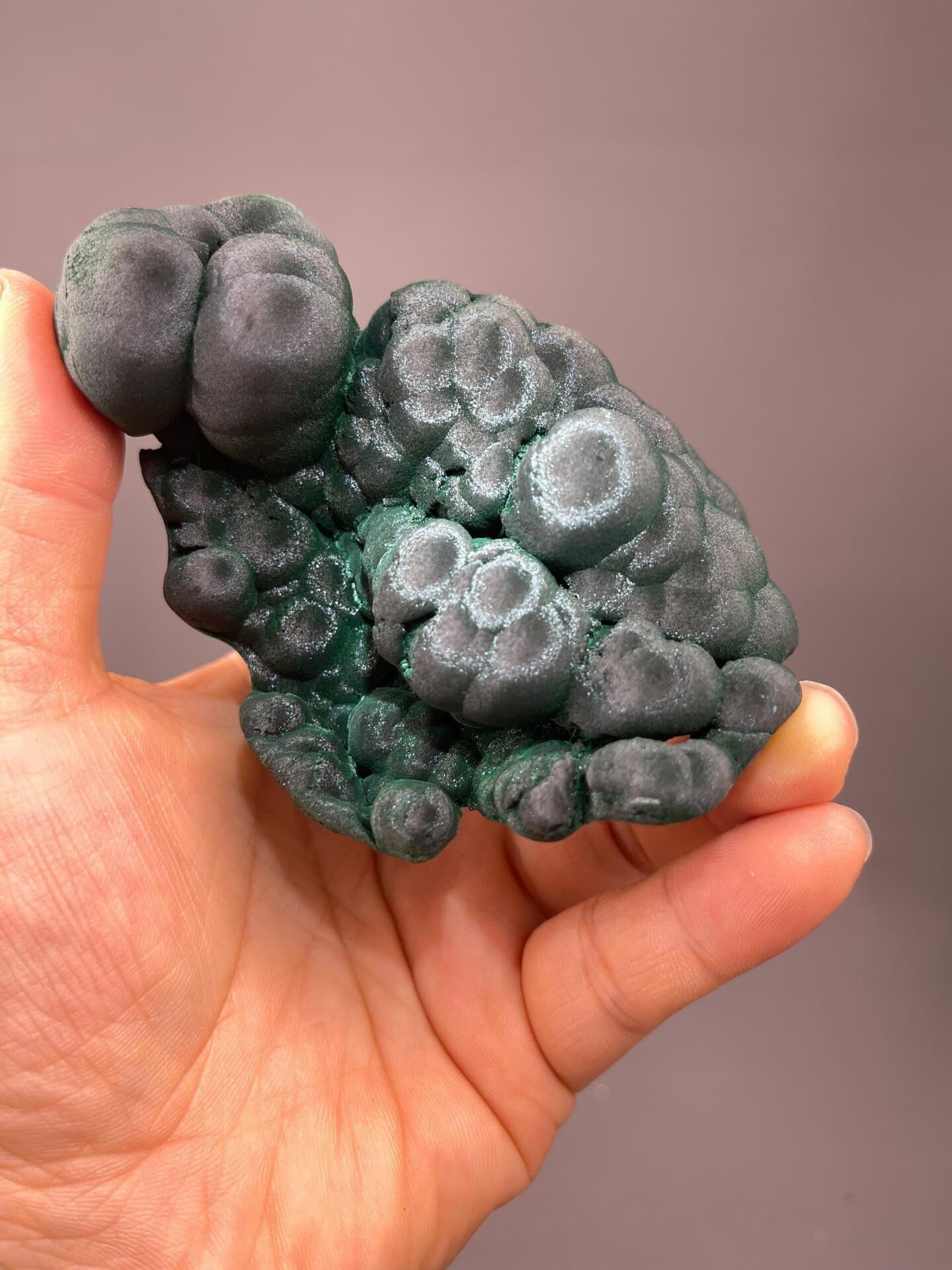 Rich emerald-green malachite nodules with banded surface