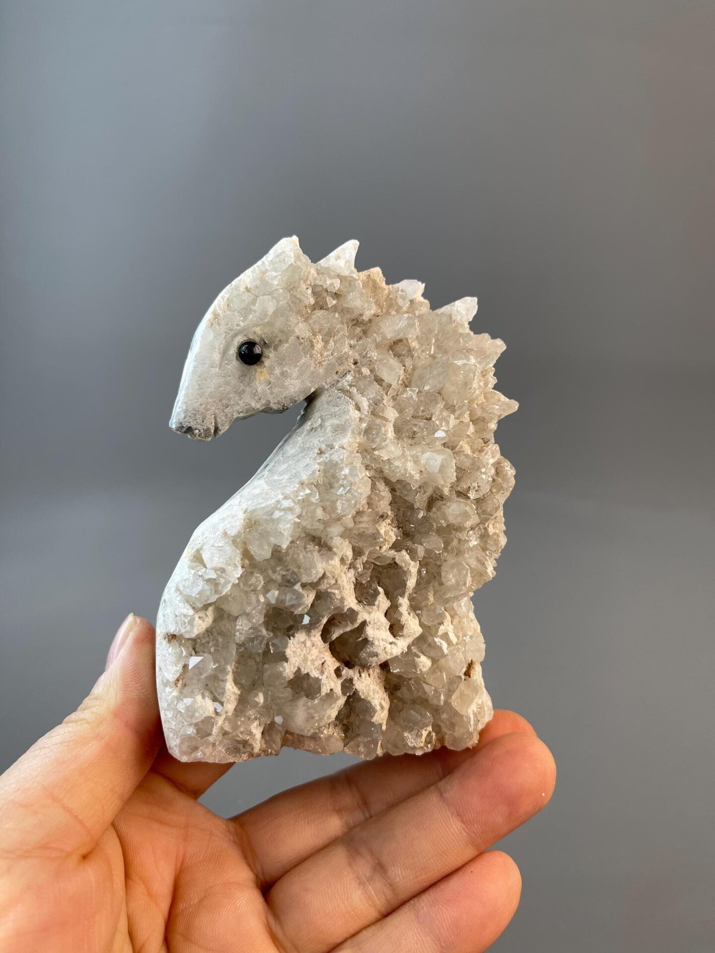 Side view of quartz seahorse hand-carved sculpture