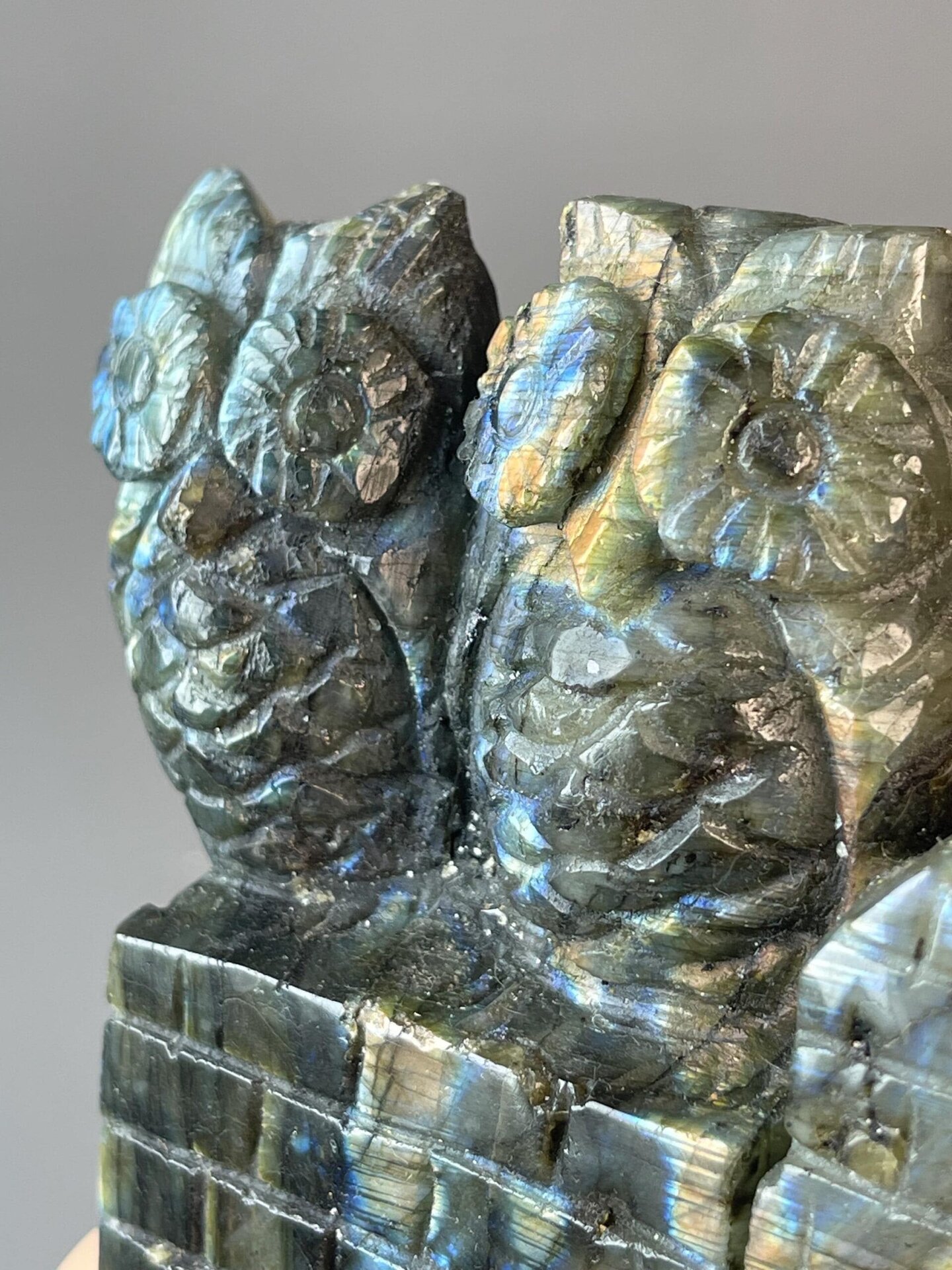 Labradorite owl showing spectral colour shift from different angles