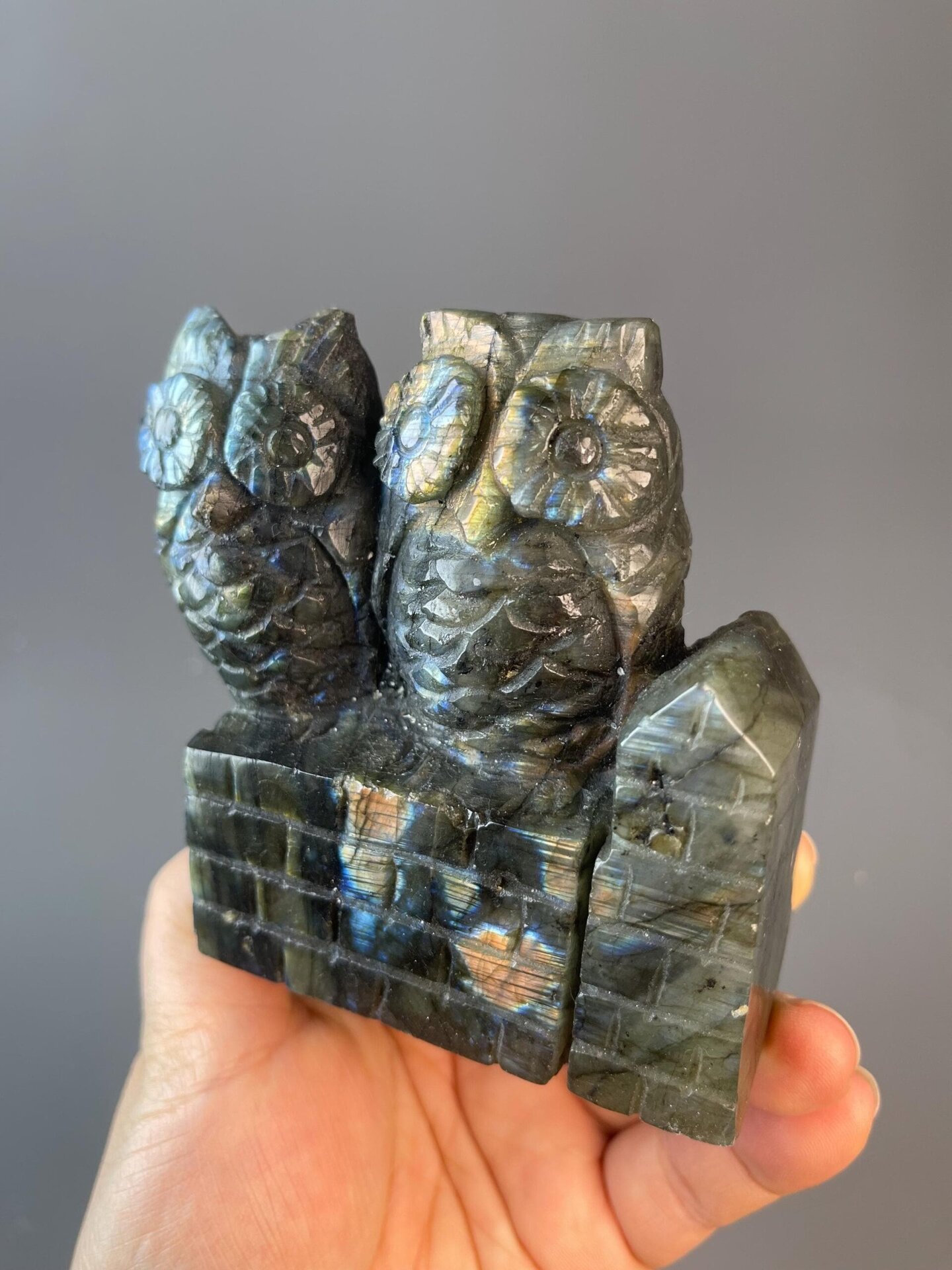 Detail of feather carving on labradorite owl sculpture