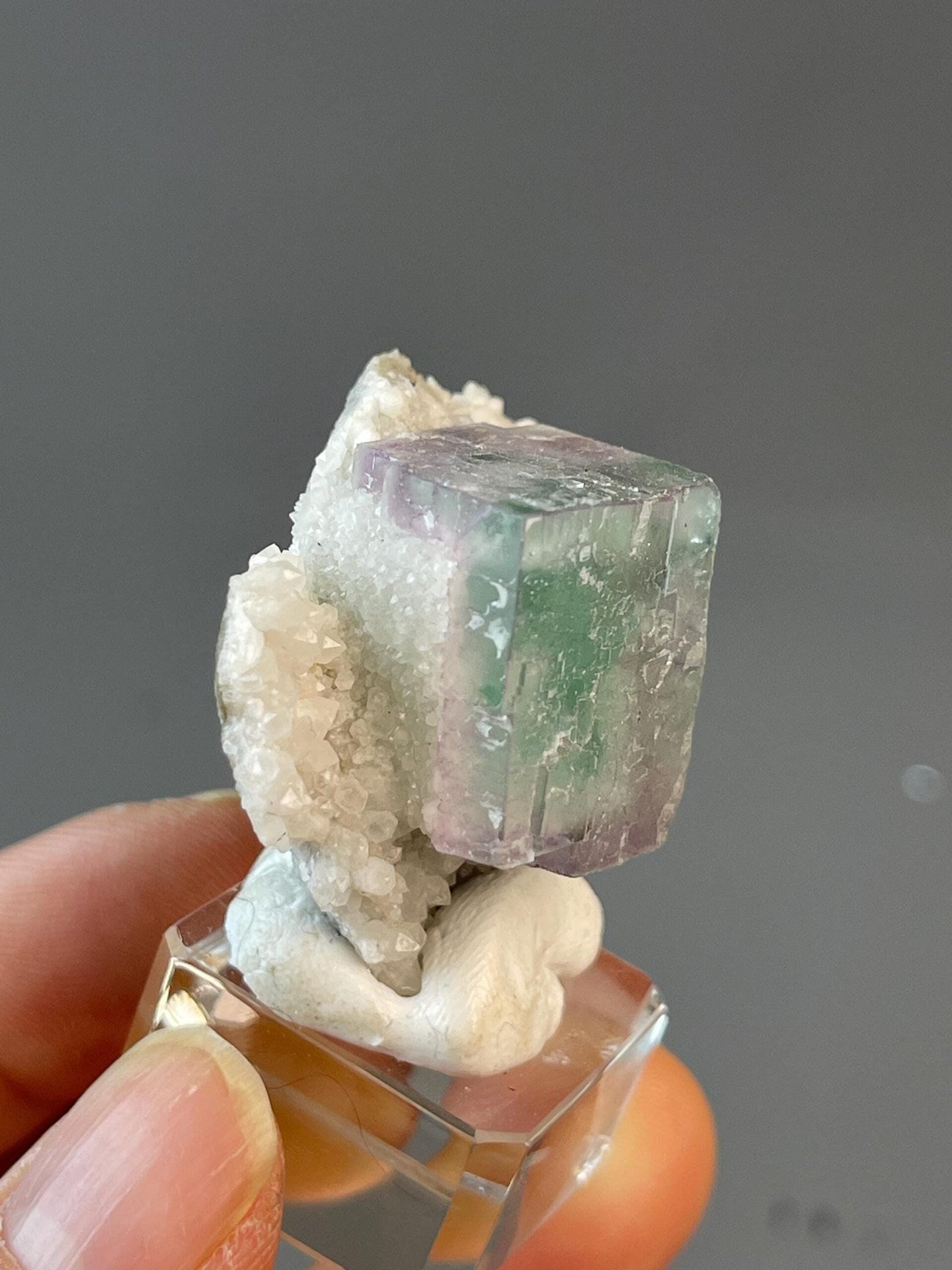 Scale view of 1.8x1.0x1.6 in purple fluorite cube