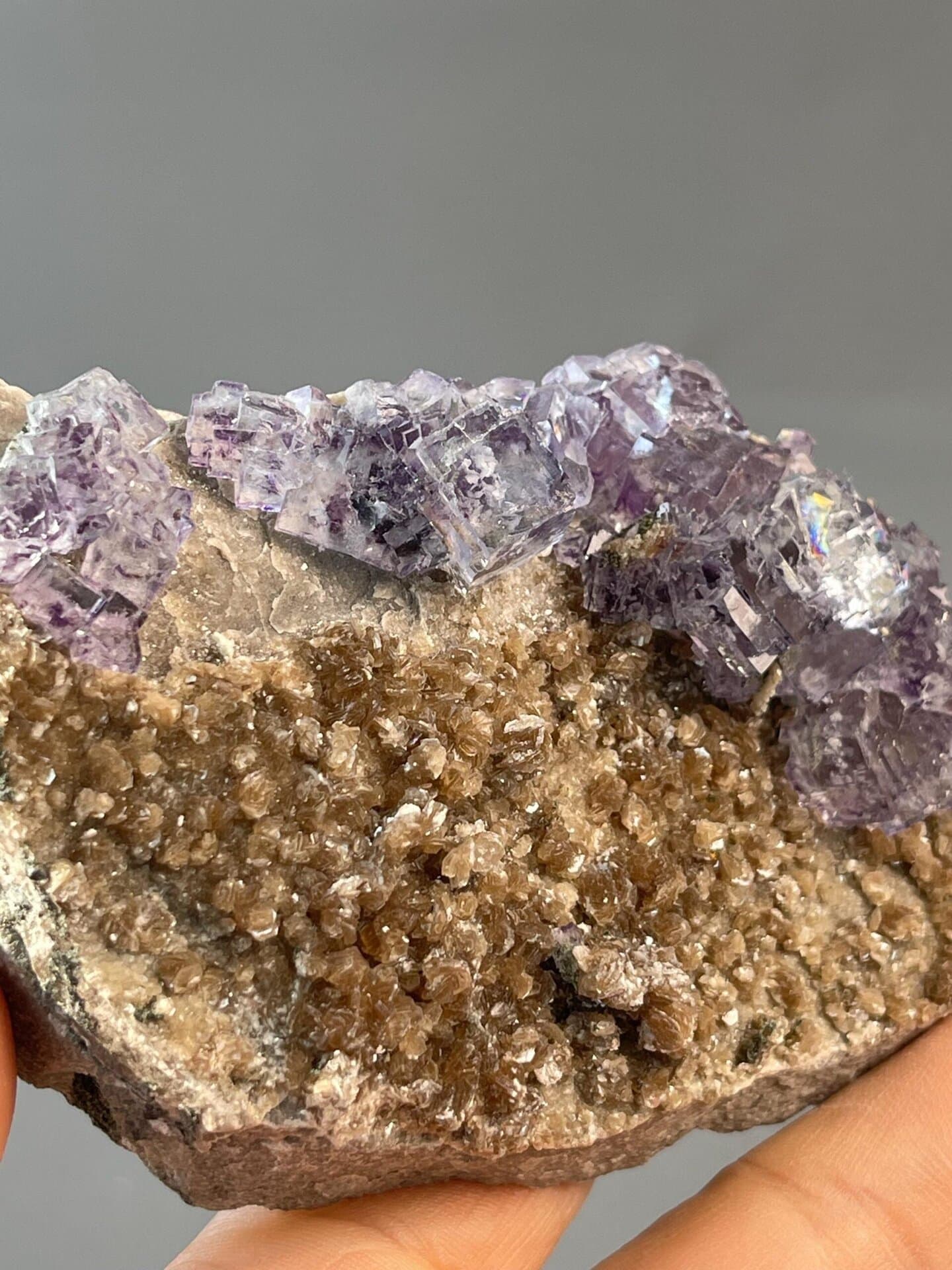 Side view of purple phantom fluorite on mica, Hunan