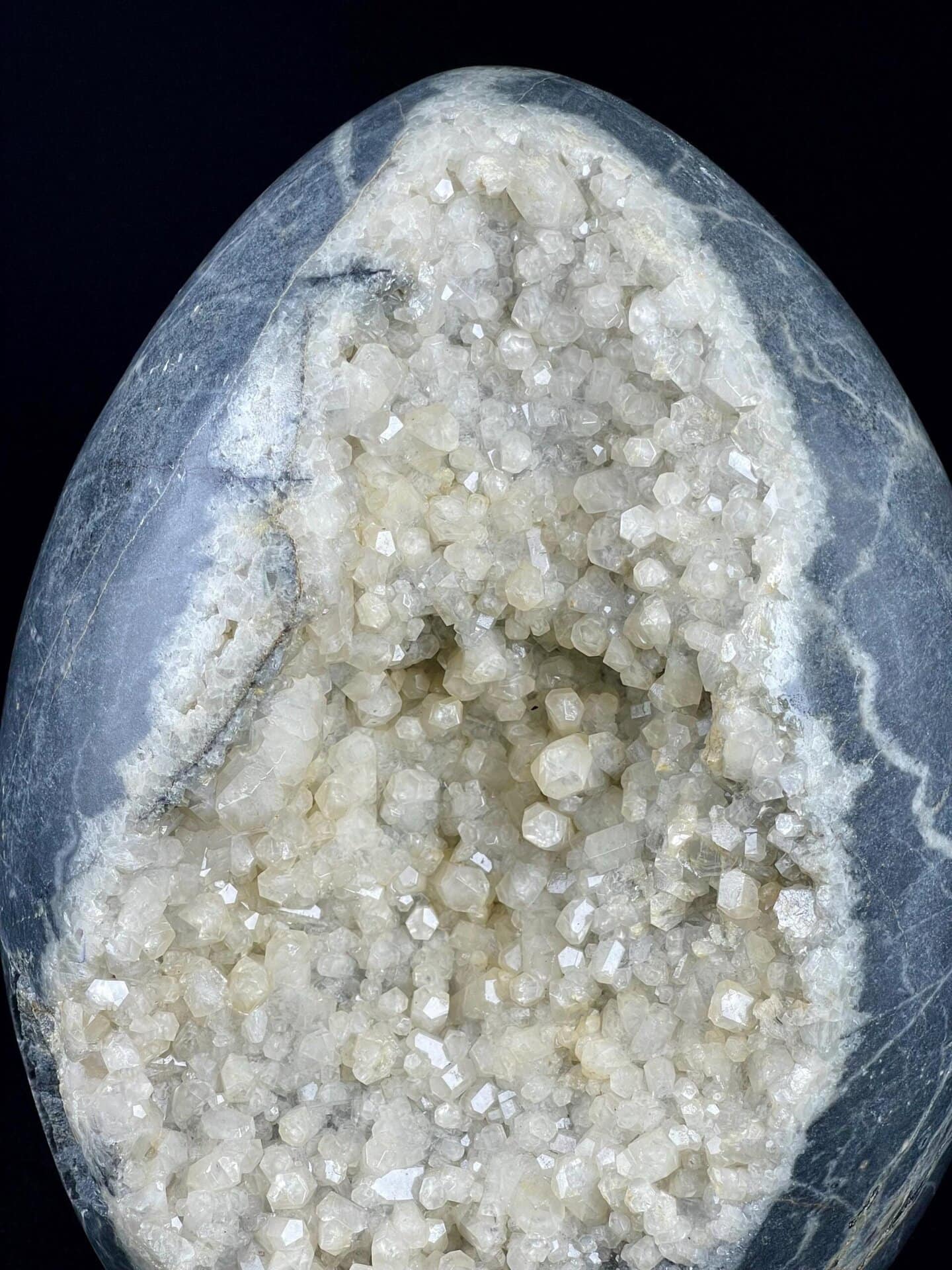 Brazilian calcite geode egg with sparkling interior crystals