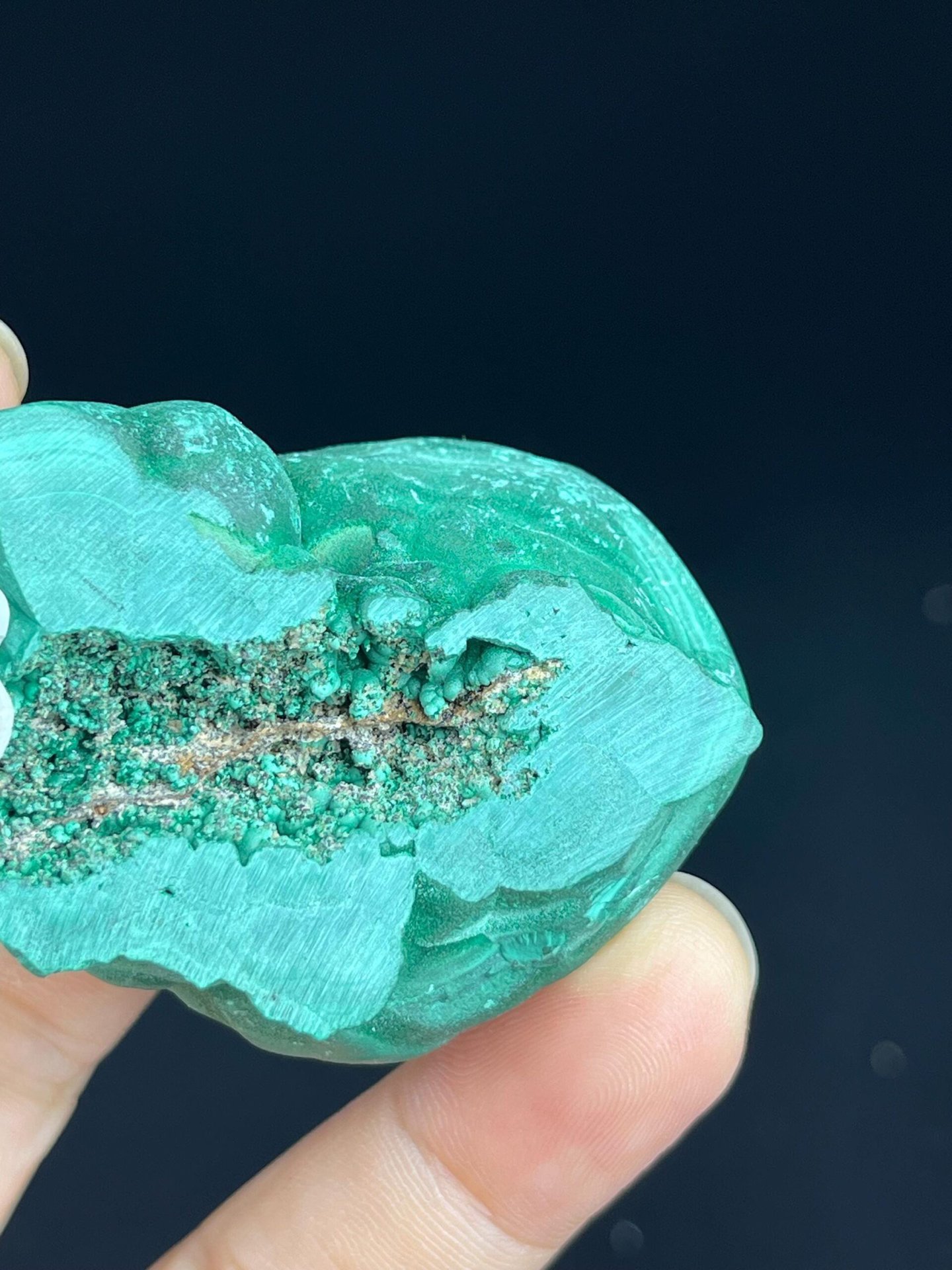 Contrasting polished and raw surfaces of Congo malachite