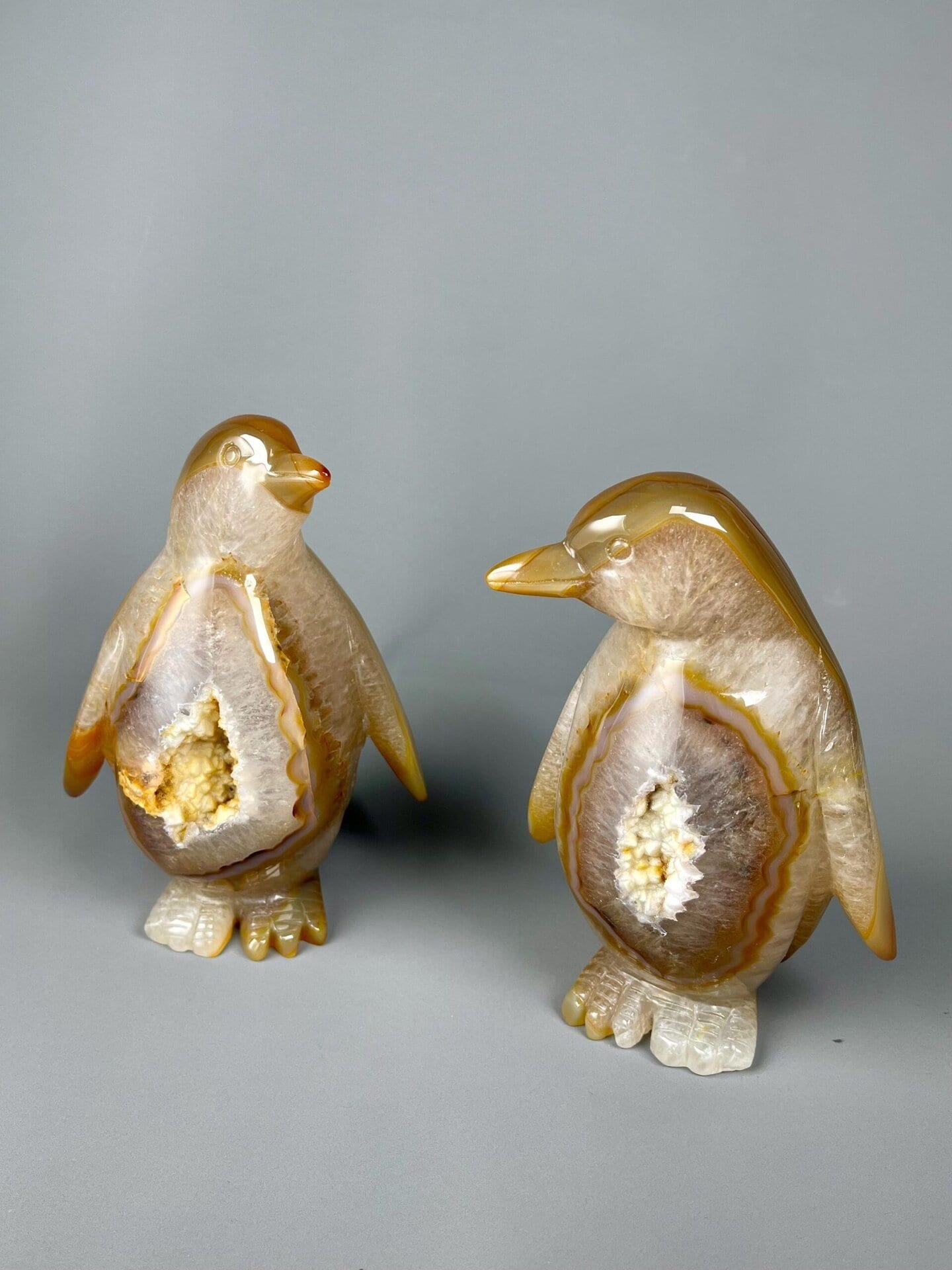 High-sheen polish on Brazilian agate penguin carvings