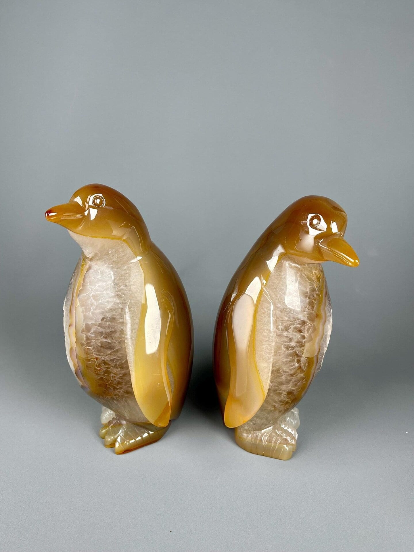 Top view of hand-carved Brazilian agate penguin sculptures