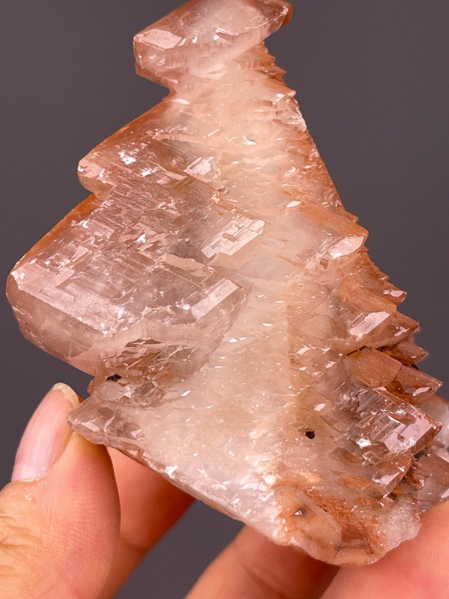 Red calcite scalenohedral tower displaying vitreous luster