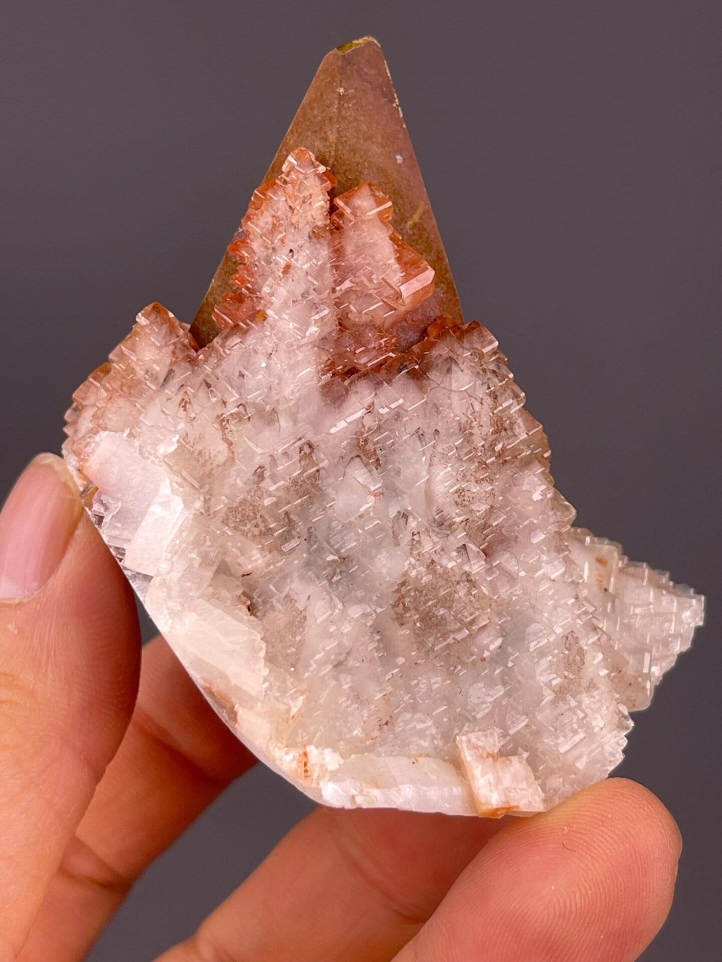 Translucent calcite tower rising from calcite blade matrix