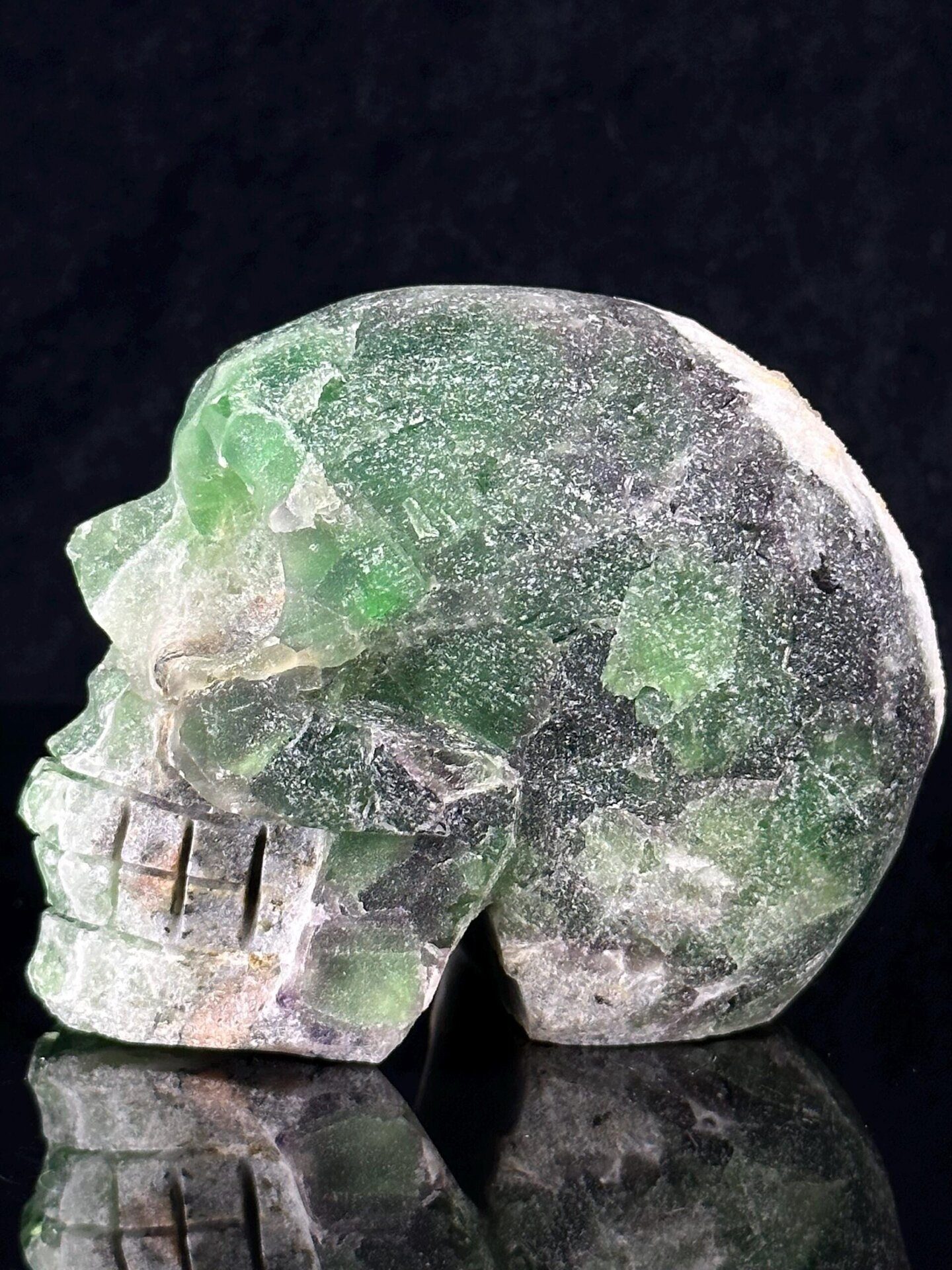 Fluorite skull carving with geode interior, 32 oz