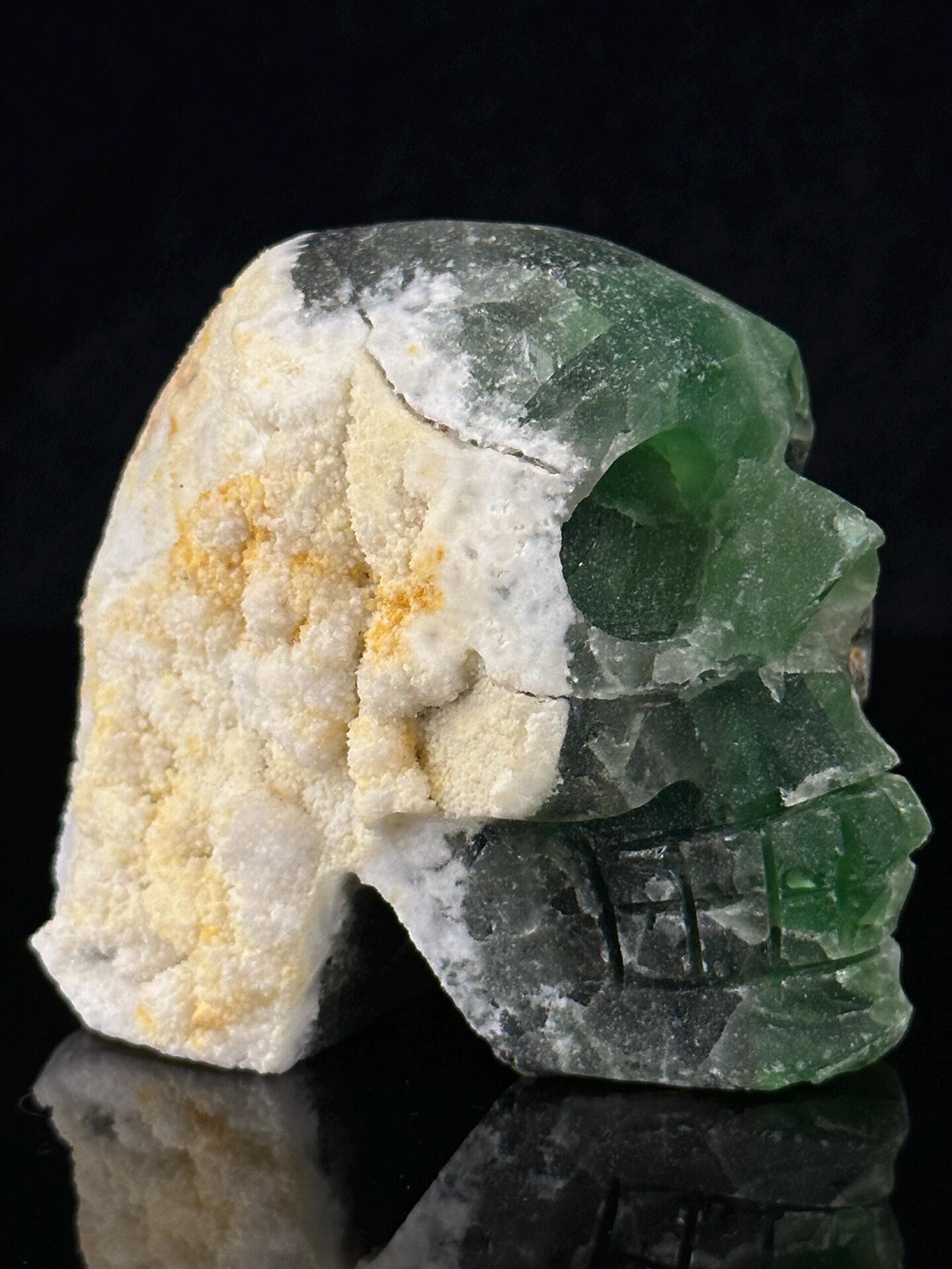 Collector carved fluorite skull with vitreous luster and natural colors