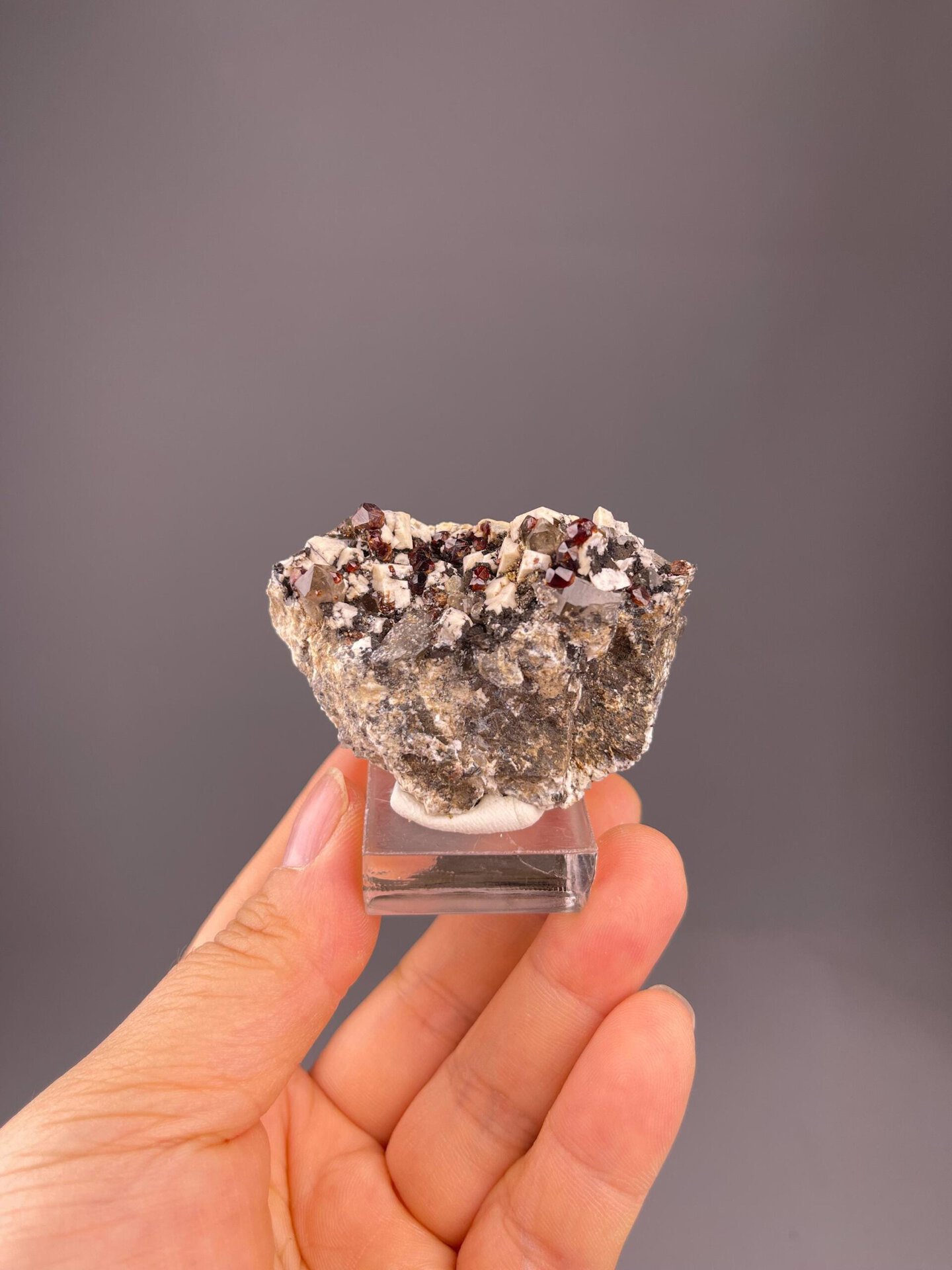 Isometric garnet silicate with associated feldspar and smoky quartz