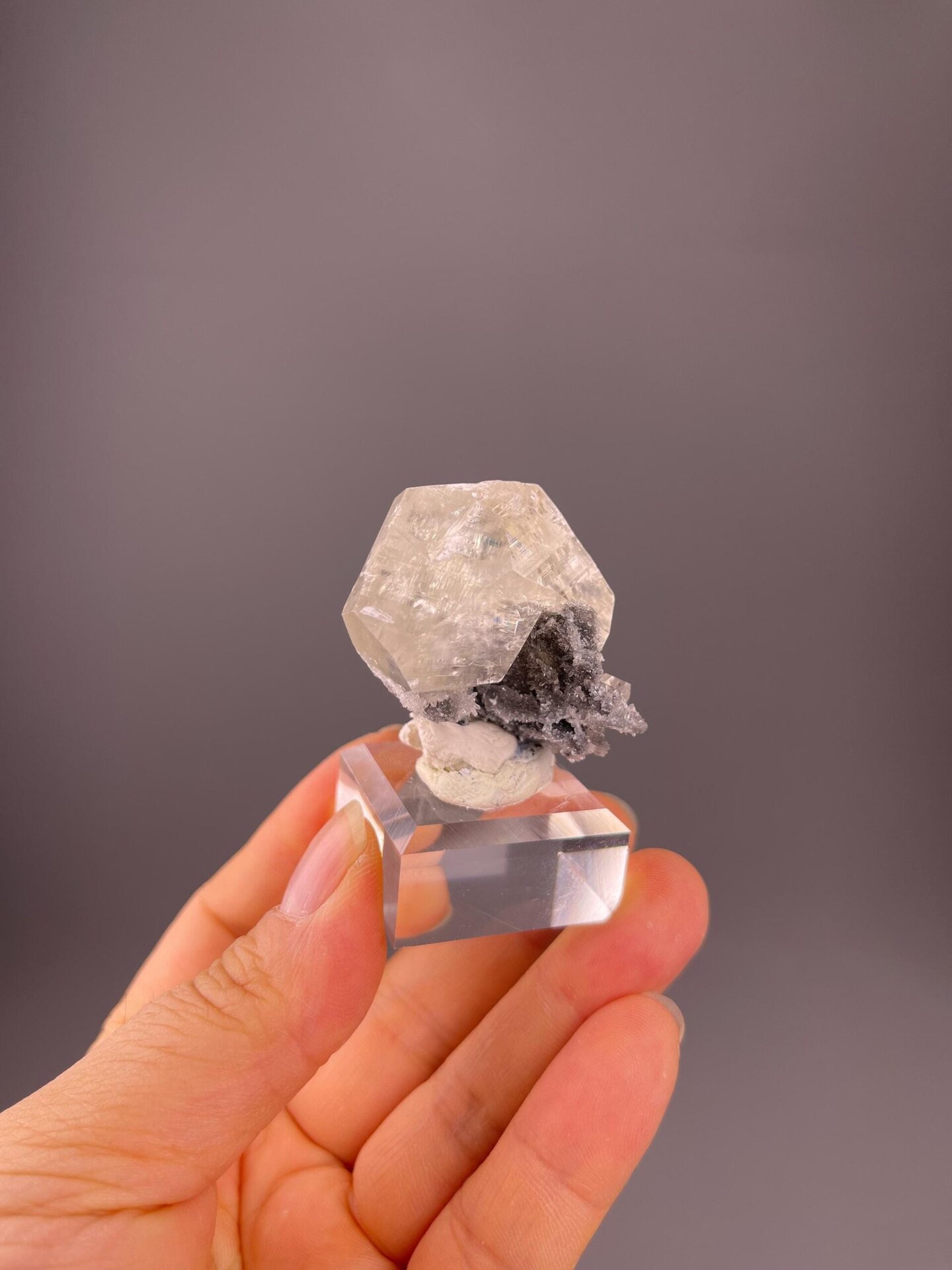 Transparent calcite crystal with perfect rhombohedral habit