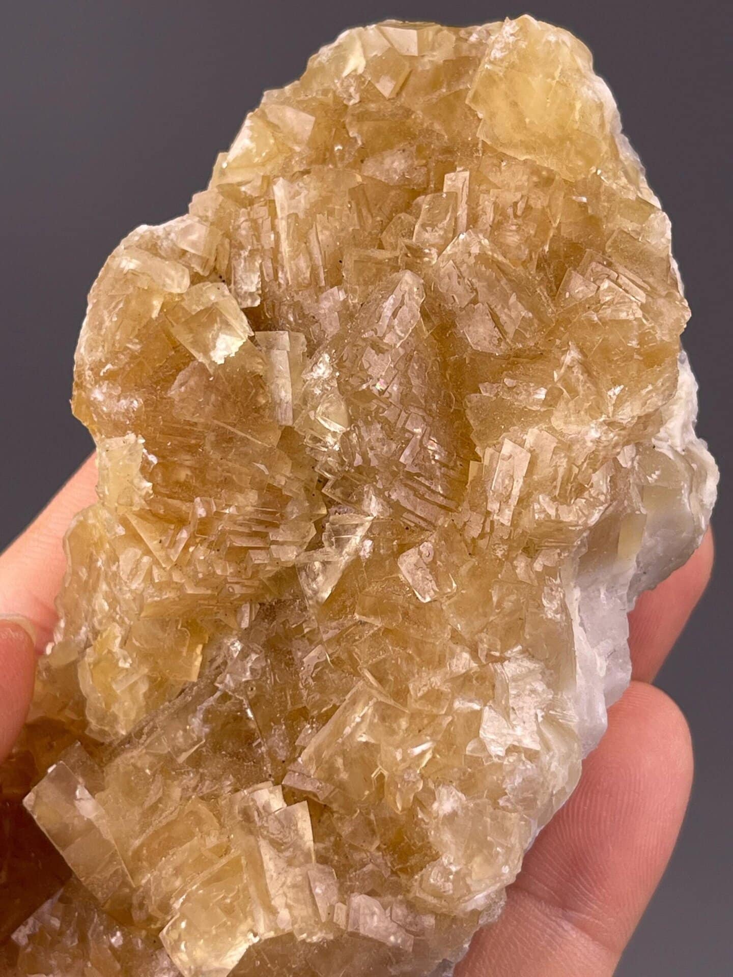 Cubic yellow fluorite crystals with warm amber tones