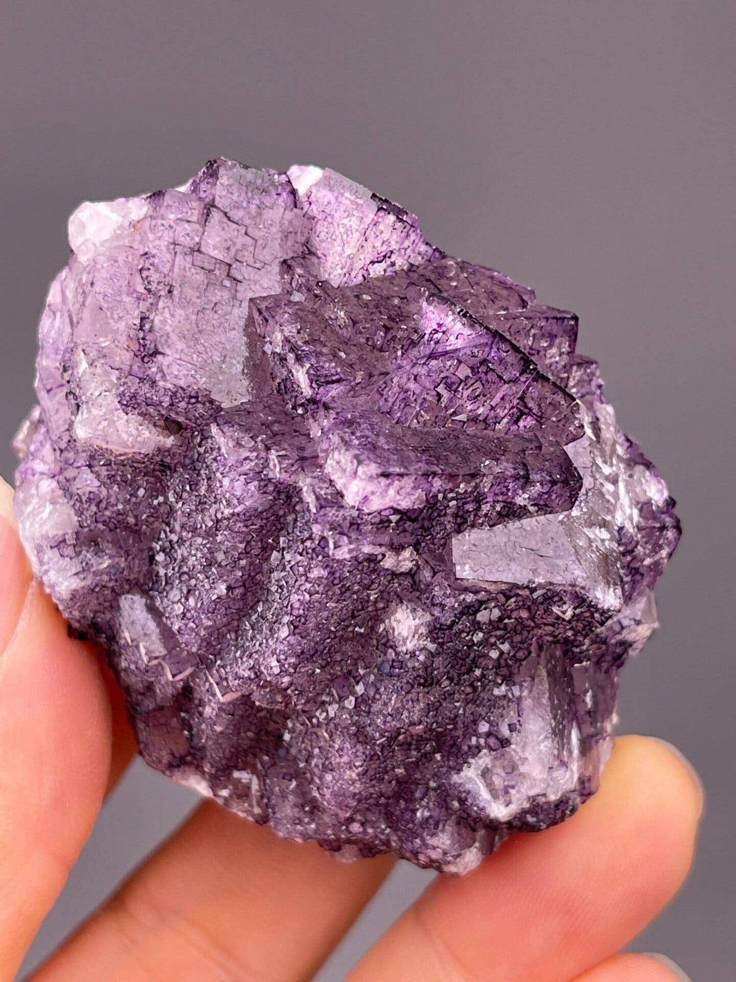 Deep purple fluorite cluster with vitreous luster from China
